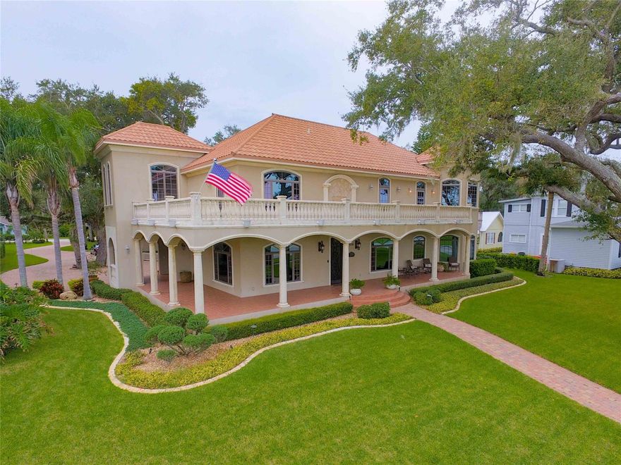 One of a Kind Riverfront Estate!  This beautiful home was built in 2007, has endless and unobstructed views of the river from EVERY room and sits on over an acre total.  The lot is accessible from Magnolia and extends to the river.  It was built with ICF solid concrete walls and floors (extremely energy efficient), hurricane rated Anderson windows and doors, and a FULL sized natural gas generator.  The generator turns on when the power turns off automatically.  Enjoy your morning coffee on the front porch, and watch the stunning sunrises.  The empty lot (which is almost a quarter acre) between the home and the river is included with this home, so nothing can ever obstruct your view.  The open floor plan is ideal for entertaining, with a complete wet bar that boosts both freezer and refrigerator drawers.  The main level features the kitchen, breakfast nook, dining room, bar area, living room , laundry room (laundry shoot from Master Bedroom).  The kitchen has a gas range, wall oven, steam oven and built-in microwave, as well as a built-in coffee maker. Reverse Osmosis system for drinking and ice making.  Access the second floor via the beautiful custom staircase or use the convenient elevator. The second floor features the Master Bedroom, with a sitting area, tray ceilings, fireplace, and custom walk-in closet.  The other two large bedrooms are on this floor, each having a private bathroom.  All upstairs bedrooms have access to the balcony and the amazing views.  The owner's office is located on the second floor, with views of the river and the back driveway.  The main house has an attached 1 car garage.  The back porch has a fireplace, a TV outlet, and an outdoor kitchen with a sink, and refrigerator.  The detached building contains a 2 car garage, an air conditioned workshop, half bath and a separate small garage for lawn equipment.  The unique roof is a metal barreled roof with 50 year warranty. Interior fireplaces are electric, fireplace on back porch is gas. ;Water: City