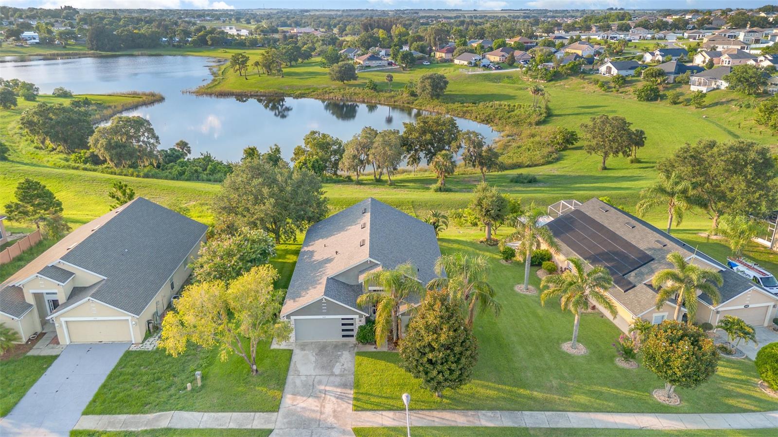 Move-in-ready gem in a peaceful lakefront community! This beautifully maintained 4-bedroom, 3-bathroom home offers the perfect blend of comfort, functionality, and Florida charm. Step inside to discover a bright, open floor plan with vaulted ceilings and abundant natural light. The spacious living and dining areas flow seamlessly, making entertaining a breeze. The kitchen features a modern layout stainless steel appliances, ample counter space, and a cozy breakfast nook—ideal for morning coffee or casual meals. The primary suite includes a walk-in closet and an en-suite bath with dual sinks and a relaxing garden tub. Enjoy serene lake breezes and Florida sunsets from your private backyard—perfect for pets, play, or weekend BBQs. Located in the desirable Vista Del Lago community, you're just minutes from US-27, Legoland, and the growing amenities of Winter Haven and Davenport. Enjoy a low HOA, no CDD, and quick access to Orlando and Tampa. Plus, you’ll be less than an hour from world-renowned theme parks like Disney, Universal, and more! Whether you're a first-time homebuyer, downsizing, or investing, this home checks all the boxes. Don’t miss this opportunity—schedule your private tour today!