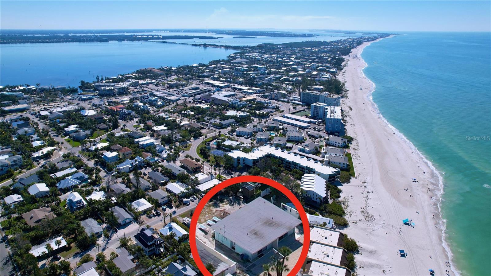 This property offers a multitude of possibilities. The expansive 6,090 square foot lot, situated directly across the street from the beach, presents an ideal location for constructing a new home with gulf views. Alternatively, the existing concrete block duplex provides a solid foundation for a remodel. Currently, the property has long-term tenants in place, offering immediate benefits of monthly income while you navigate the permitting process or plan for your future retirement. Both 1BR/1BA units reflect the residents' pride and joy in Island living. Each unit enjoys a private brick paver patio in the spacious backyard. With beach access just two doors away and the Holmes Beach shopping district within a few blocks, this property offers an unparalleled island lifestyle.