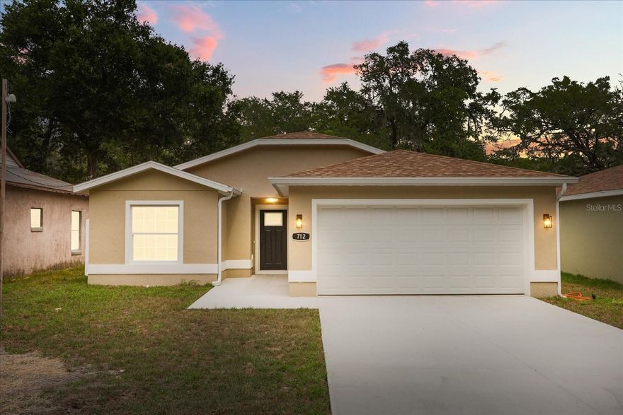 No HOA, USDA loan eligible. Welcome to your brand-new retreat. Step inside to find luxury vinyl flooring flowing throughout, giving the home a seamless and refined look. The open layout is designed for both easy living and effortless entertaining, while a flexible bonus space adapts to your needs, whether that’s a home office, workout area, or creative studio. Every corner of the home feels bright, fresh, and thoughtfully designed, offering the added confidence of brand-new construction. Outdoors, enjoy a private backyard that provides both tranquility and room to relax or gather. The garage stands out with its epoxy-coated flooring, adding a polished, upscale touch. The location puts you just moments from nearby boat ramps, making it simple to get out on the Harris Chain of Lakes for a day on the water. You’ll also appreciate the quick access to surrounding Downtown Leesburg, Mount Dora, Eustis, and Tavares, where local dining, shopping, and waterfront views are always within easy reach. Call for your private showing today! Save Big: Receive a 1% lender credit toward closing costs or rate buy-down. Ask for details!