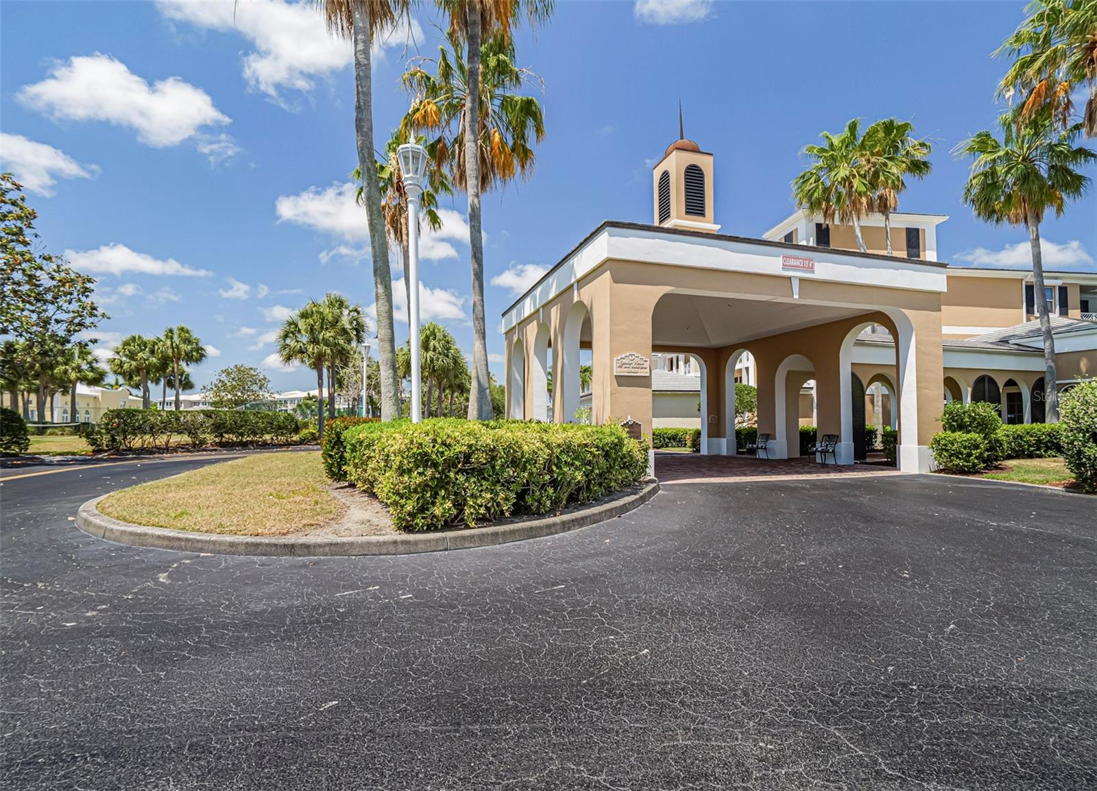 Elegant Country Club living in this second floor condo built by Proctor Construction. Beautiful views of lake, golf, nature, & wildlife! Superior quality amenities including impact windows and sliders, electric rolldown shutters for easy hurricane protection, plantation shutters, fire sprinkler system throughout, crown moldings, nicely remodeled kitchen & bathrooms, gleaming hardwood floors, central vacuum, custom built-in cabinetry, keyless front door entry system, washer and dryer, screened porch, and tray ceiling. One car garage. Various memberships opportunities.