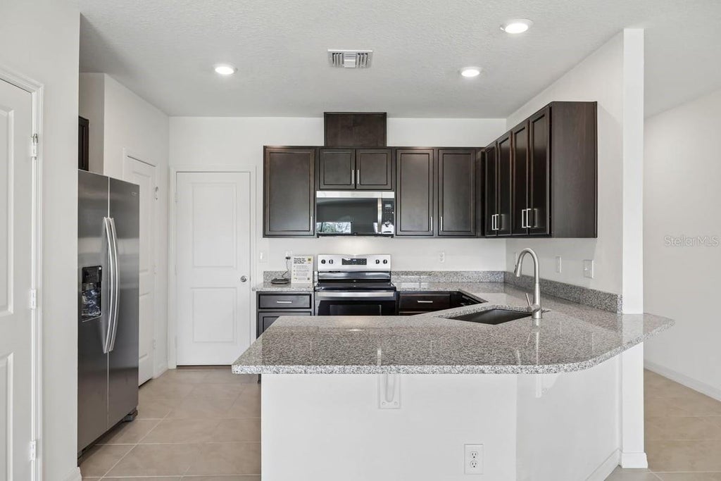 Photo of 394 Sequoia Drive, Lake Wales, FL 33859 (MLS # O6443189)