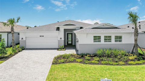 Photo of 14447 Coastal Woodland Lane, Parrish, FL 34219 (MLS # W7885068)