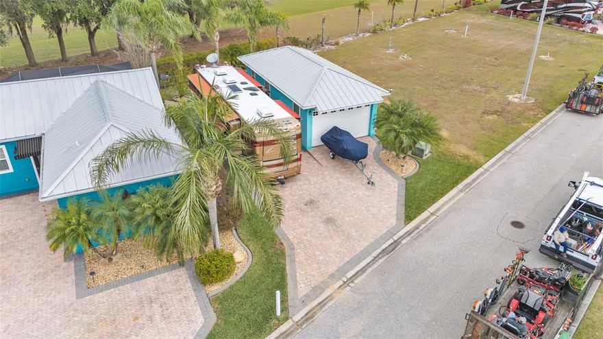 Bring on the TOYS!!! This lovely Paver Pad with a Garage casita can fit your extra car, motorcycle, and more! It is equipped with a full bathroom and pre-plumbed to add a future kitchen if you desire to finish out the garage into living space. The cozy back paver patio is the perfect place to sip coffee or have drinks with friends while you enjoy your very own slice of paradise!

Bay Lake Motorcoach Resort is a Class A motorcoach resort offering incredible amenities. Owners and visitors can fill their days with activities and club outings or simply relax and enjoy the resort. Whether in search of community, travel, relaxation or recreation, Bay Lake is your home base for the Florida Lifestyle.