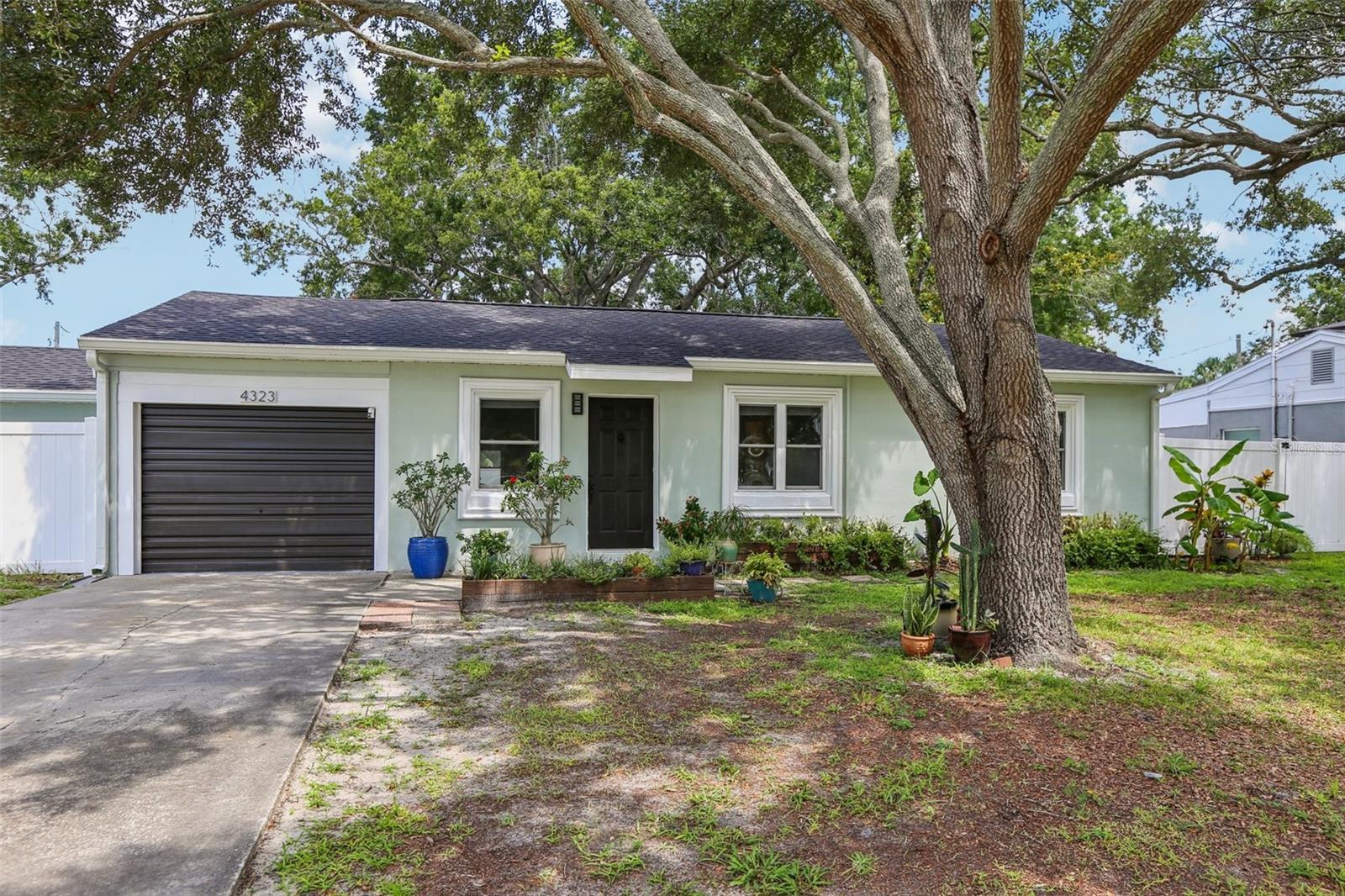 Welcome to this charming South Tampa gem, ideally situated on a picturesque street in one of Tampa’s most desirable
neighborhoods! This well-maintained home features a brand-new roof (July 2025) and sits on a large, fully fenced oversized lot (.28 Acres) —perfect for entertaining, relaxing, or storing your RV or boat. Inside, the heart of the home is a thoughtfully designed kitchen, complete with granite countertops, wet bar, a wall pantry featuring pull-out shelves, and a refrigerator that includes a craft ice maker. This property also features a garage with a convenient half bathroom, ideal for hobbies, projects, or additional utility space. A separate workshop is equipped with electricity, A/C, and an air filtration system, making it a dream for any enthusiast. Further highlights include ample attic storage. Located in vibrant South Tampa, you’re just minutes from top-rated schools, restaurants, shopping, MacDill AFB, Bayshore Boulevard, and downtown. Don’t miss this rare opportunity to own a move-in-ready home in a prime location with room to grow!