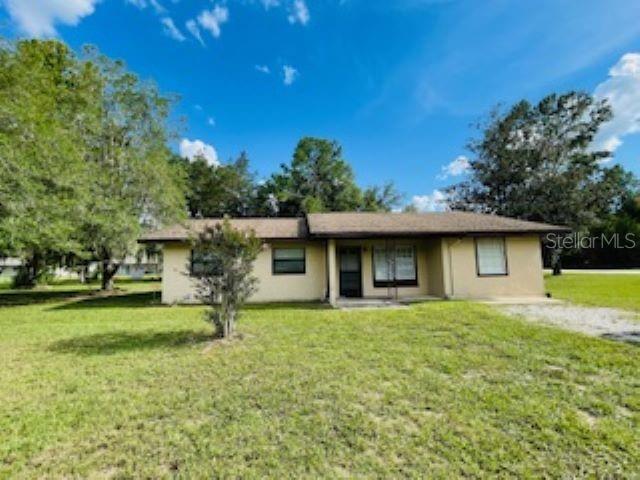 One or more photo(s) has been virtually staged. MOVE IN READY AT A GREAT PRICE! Bring your UTV's, Boats, RV's! Plenty of room for all your toys at this non-HOA property. Room to add a pool if desired. Don't miss out on this delightful 3-bedroom (has large bonus room with closet that can be used as a 4th bedroom, flex space or in-law suite), 1-bathroom single-family home, offering 1,227 sq. ft. of living space. Lovely screened in back porch. Freshly painted interior. LVT flooring throughout. No carpet here! Situated on a LARGE 3/4 ACRE LOT, this home is ideal for anyone looking for room to grow, with a 24x24 CONCRETE BLOCK DETACHED GARAGE or workshop. Central Heat & Air – Stay comfortable year-round with reliable climate control. Large Indoor Laundry Room – Convenient and spacious with plenty of storage. No Water/Sewer Bills – Enjoy the savings of well water and septic system. Electricity Through SECO – Another added benefit for lower utility costs. Located in a desirable area with easy access to local amenities, this home offers both comfort and convenience. Schedule your private tour today and make this fantastic property yours!