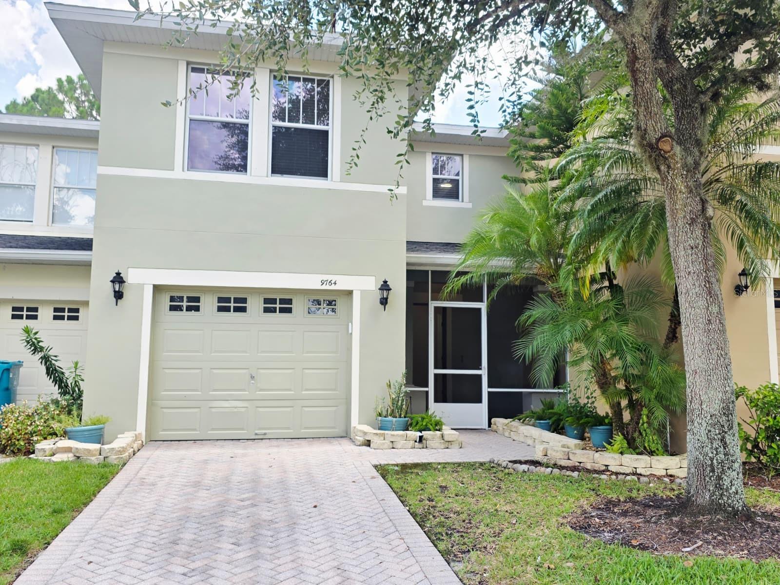 Beautiful 3BR/2.5BA townhome in gated Tivoli Village with serene pond views and backing to conservation views. Concrete block on both floors, enjoy the convenience to a 1-car garage, and paver driveway leading to the screened porch. Open floor plan with formal dining, kitchen with 42” wood cabinets, stainless appliances, breakfast bar, and pantry. Spacious family room opens to screened patio overlooking conservation area. Upstairs features versatile area for a loft/office, master suite with walk-in closet, double quartz sinks, garden tub/shower, plus two bedrooms (one with walk-in closet). Laundry upstairs which adds convenience. Community pool & dog park; HOA includes lawn care. Centrally located near major highways (417, 528, 408), just 15 minutes to Downtown Orlando, 5 minutes to Orlando International Airport, and approximately 20 minutes to the theme parks. Call Today to Schedule a private tour.