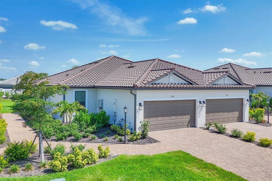 Impeccably upgraded, ideally sized 2 bedroom/2 bathroom plus office home in vibrant Azario for those seeking upscale ambiance, resort amenities and minimal maintenance in a country club setting. The Ibis open-concept floor plan has a centrally located kitchen that opens effortlessly to the great room and dining room. Countertops showcase polished quartz, solid wood gray cabinetry, under-cabinet lighting and externally vented range hood. An elegant primary suite has an oversized walk-in closet, dual-sink vanity, shower stall and water closet. At front of the home is a private guest suite with attached bath and a versatile den/office/flex space with pocket doors. Thoughtfully accentuated with tray ceilings, crown molding, 8-foot doorways, upgraded lighting package and designer fixtures. Motorized blinds provide sun control and privacy across great room's triple sliders and owner's bedroom suite windows. Extended screened lanai offers breezy landscaped views. Large laundry room with upper/lower cabinetry, utility sink, smart home technology, surround sound and epoxy-coated two-car garage. Azario offers 18-hole golf course, aqua driving range, heated beach-entry pool with cabanas, hot tub, state-of-the-art fitness center and classes. The Venue has billiards, ping-pong, cards and clubs. Full service poolside tiki bar, culinary center with cafe, fine dining, upscale lounge, patio eats, cafe, teaching kitchen and wine tastings.