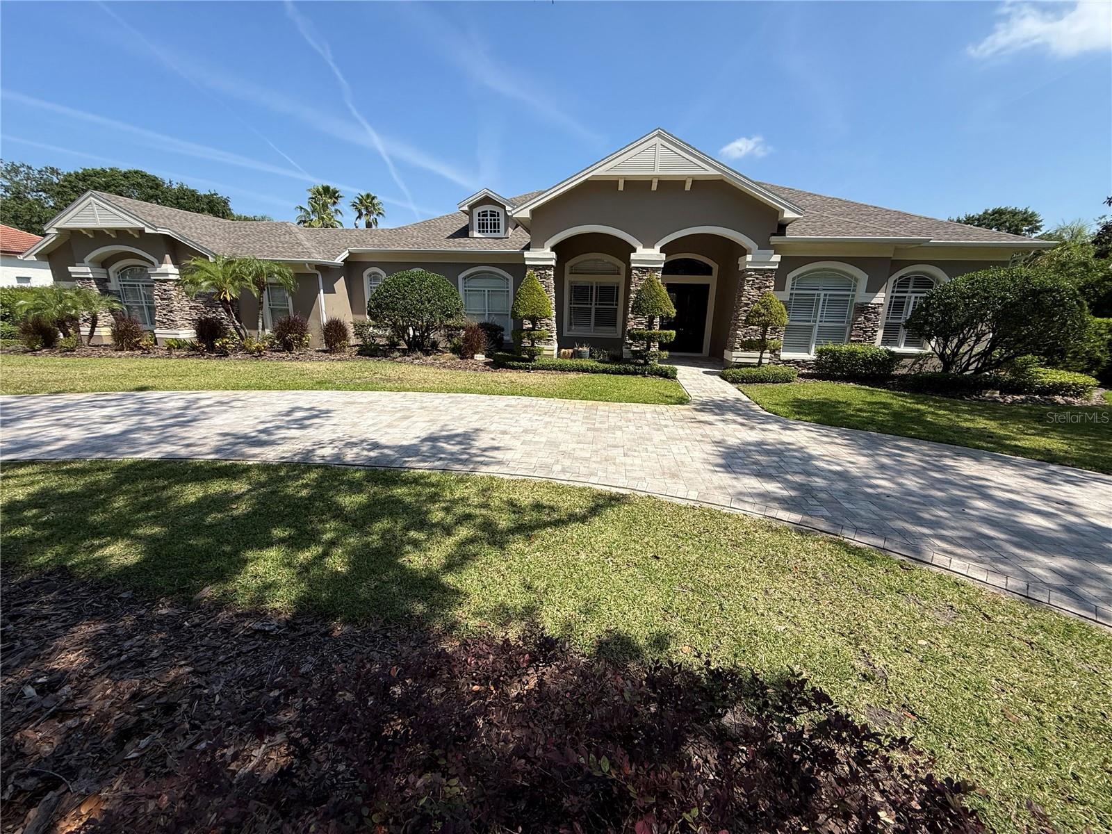 Welcome home to Keystone Shores a premier gated neighborhood. This expansive and unique custom home welcomes you to tranquil living. Tons of fenced in exterior space for dogs to roam. Wildlife sightings. Wood burning fire pit outside of screened in pool. Mature queen palms and majestic oaks. The floor plan allows for magnificent natural light to shine through its grande windows. Quartz countertops in the kitchen with Subzero and Wolf appliances. A home where elegance and country charm meet.
