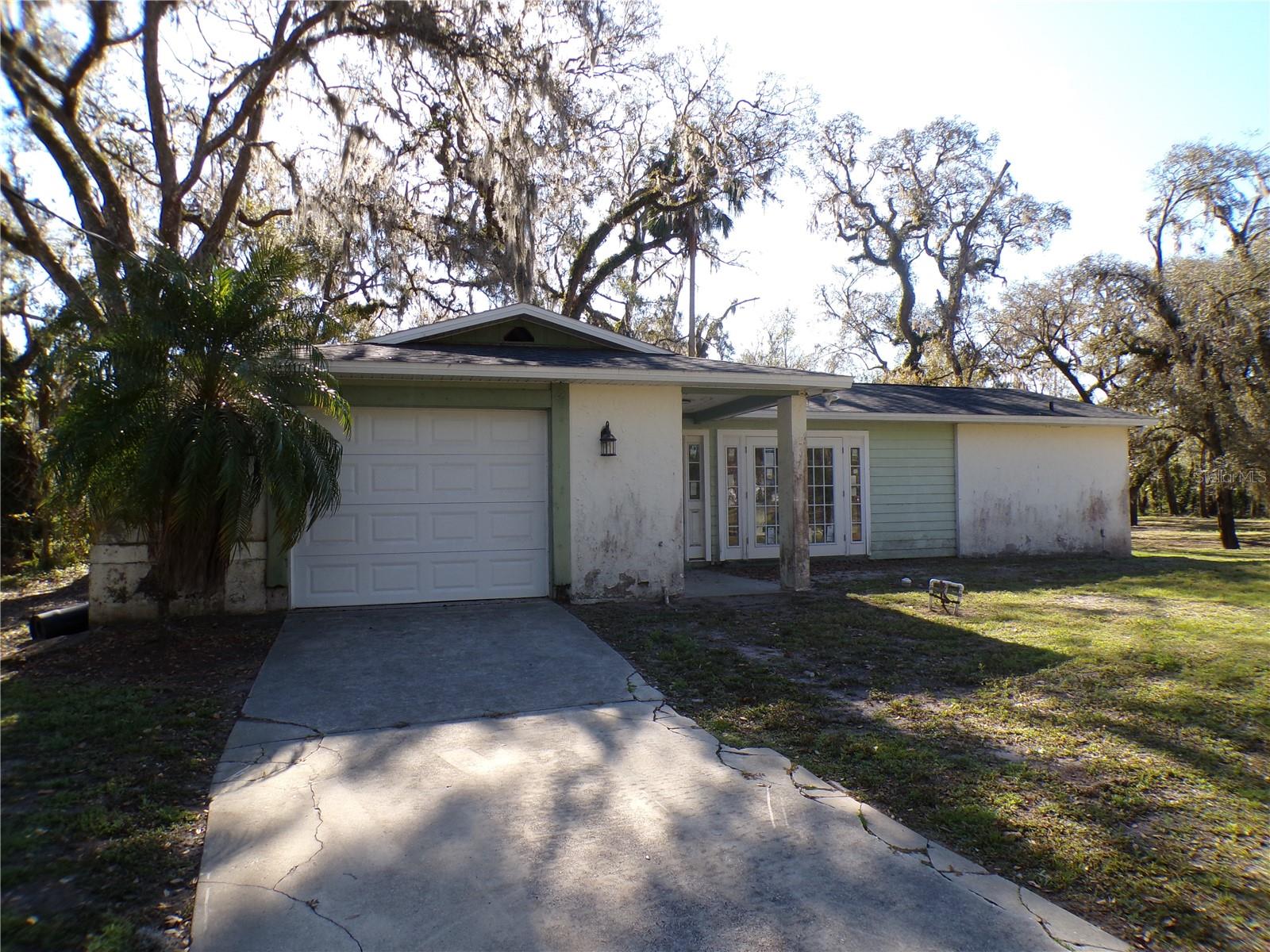 Scenic riverfront property on a small part of the Alafia. Enjoy canoeing, kayaking, and nature from your backyard! The existing block stucco home has 2 bedrooms and 2 bathrooms with approximately 1378 square feet of living area and a 1 car garage. Nice property is a double lot with towering oaks on a cul-de-sac street. The convenient location is just 2.5 miles South of Bloomingdale Ave with shops and restaurants, and 2.5 miles to the County Lithia Springs Conservation Park, a 160-acre site with swimming, camping, hiking, and other outdoor activities. This is a Fannie Mae HomePath property.