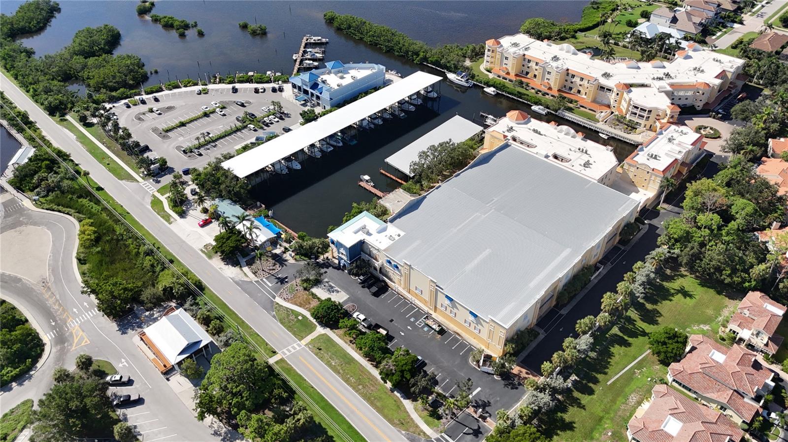 A rare find in Sarasota, this covered 50 ft wet slip at Osprey Harbor Village offers the perfect blend of protection, convenience, and value.
Located at 480 Blackburn Point Road in Osprey, just off the Intracoastal Waterway, this sheltered slip keeps your yacht out of the Florida sun with quick access north to Sarasota Bay or south to Venice, Midnight Pass, and no fixed bridges to the Gulf. Enjoy the benefits of ownership without the million-dollar price tag of waterfront real estate, complete with on-site restrooms, water, electric, wifi, pump-out services, a fuel dock, adjacent restaurant, and secure, well-lit docks. Unique to wet slips, you won't just own the slip itself, but also the land below and the sky above! Low quarterly fees make this an exceptional opportunity for any serious boater or investor.