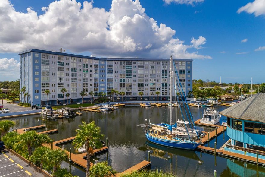 Live the Florida waterfront lifestyle you’ve always dreamed of in this beautifully furnished 1-bedroom, 1-bath condo with a DEEDED BOAT SLIP and direct Gulf access—no bridges and deep water! Perfectly positioned on the 5th floor, this light and bright unit offers unobstructed views of the wide canal leading straight to the Gulf, where you can watch boats pass by or catch a glimpse of the sunset reflecting off the water. Step inside and you’ll find a comfortable open-concept floor plan with floor-to-ceiling windows that fill the space with natural light. The interior features neutral, transitional tones that complement the coastal surroundings, and a modern kitchen with newer stainless-steel appliances and quartz countertops, ideal for easy entertaining or quiet evenings in. Spend your days relaxing by the heated waterfront pool, grilling with friends at the community gazebo, or enjoying a little friendly competition on the shuffleboard courts. Fishing spots and marina access are right at your fingertips, and for just $200/year, you can join the exclusive Gulf Harbors Beach Club, offering private beach access with powdery white sand, turquoise water, and breathtaking sunsets. The monthly condo fee covers cable, internet, water, sewer, trash, and pest control—everything you need for a maintenance-free lifestyle. You’ll also have a COVERED ASSIGNED PARKING SPACE and plenty of guest parking for days spent out on the boat. Located just minutes from downtown New Port Richey’s vibrant dining, shopping, and entertainment scene, and close to medical facilities, marinas, and beaches, this location truly has it all. Whether you’re a snowbird looking for a sunny retreat, a boater ready to live the waterfront life, or simply seeking a peaceful full-time home, this condo is your gateway to Florida living at its finest