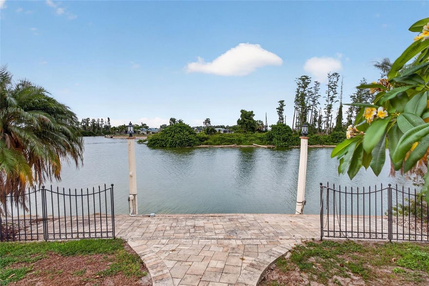 Lake Front opportunity in an active over 55 community.  Bring your pontoon boat, or fishing poles and enjoy the wildlife that abounds in your back yard. Welcome to Middle Lake, a hidden waterfront gem that allows you to moor your pontoon boat in your backyard. There are bass in the lake and plenty of catfish. The lake is about 35 acres and features two natural and picturesque islands.  These Islands serve as protected bird rookeries and are home to approximately 28 species of birds that you can enjoy viewing from the comfort of your screen enclosed patio or outdoor courtyard while barbequing with friends or grilling a hot dog on the fire pit.  Sometimes you will watch the great blue heron perch on your bank or nest on the island across from your patio, many times you will see egrets, ibis, roseate spoon bills, wood storks that come in and roost on the trees and you will occasionally get visits from the osprey or the bald eagle.  Every now and then you will get to hear the horn-rimmed owl and spot the red tail hawk that occasionally perches on the roof.  Oh yes there are buzzards that live on the islands and a host of other wildlife too. 
 This 3 bedroom 2 and 2 half bath Mediterranean style has a one-of-a-kind lake setting that gives plenty of peaceful relaxation.  
Most of the windows were replaced with hurricane impact windows, and a new roof was put on in 2023.  The air conditioning was replaced in 2024.  Rock pavers in 2020.  
Oh, and if you like fresh avocados then check this house as it has an avocado tree full of avocados that will be ready in late June and early July.  A Myers lemon in front is full of lemons, a fig tree, elderberry and a few other edible fruit trees large enough to bear fruit. 
Golf carts are a second mode of transportation to visit neighbors, attend community events, grab a bite to eat, shop, or run errands nearby. And the hospital is about 5 minutes away from this home. The community offers an impressive variety of clubs and activities, including swimming, cards, horseshoes, sewing, stained glass, bingo, and many more social opportunities designed to fit every interest and lifestyle.
Conveniently located with easy access to Interstate I-75 that will lead the way to Florida’s award-winning Gulf Coast beaches, downtown Tampa, sporting events, entertainment venues, shopping, and dining are all within reach. Enjoy cheering on the Tampa Bay Buccaneers or catching a Rays game just a short drive away. Schedule your private showing today and discover why so many residents love calling Middle Lake home.
Property is being sold ‘as is” with no warranties expressed or implied.  Buyers should satisfy themselves as to the room measurements as they are approximate.  Information contained herein is subject to change without notice.