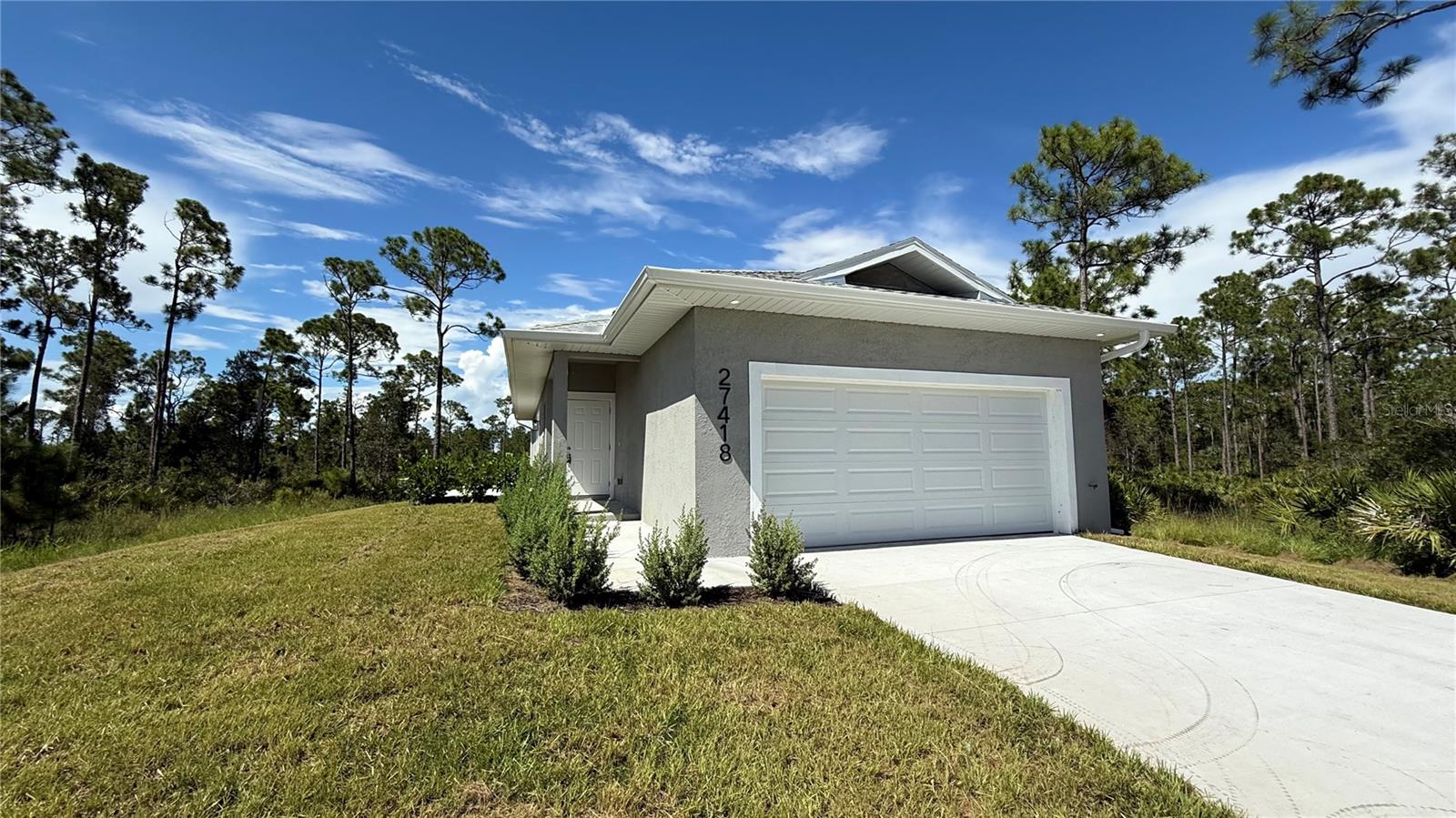 Quiet and inviting, this 2 bedroom plus den home is located in a peaceful section of Tropical Gulf Acres. The property features high ceilings, an open concept layout, and commercial grade LVP flooring throughout with no carpets. The den offers extra space that can be used as a home office, guest room, or hobby area. A two car garage provides plenty of storage and parking, and well service is included for added convenience. Pets are welcome with approval, making this a versatile home for many lifestyles.