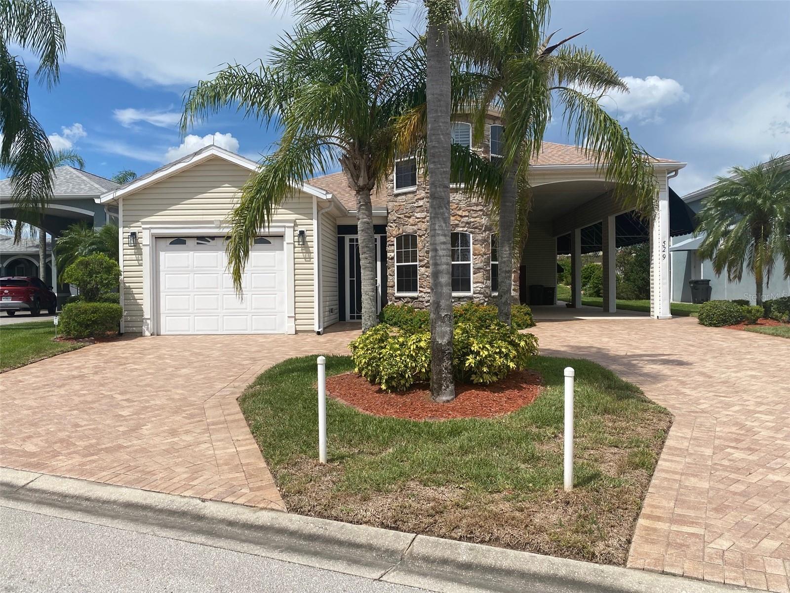 Welcome to your perfectly sized haven in the sought after community of Mt. Olive Shores North, a 55+ RV Community. This charming 3 bedroom/3 bath home built in 2006 has been recently updated with thoughtful touches that make daily living a breeze. The kitchen showcases beautiful quartz countertops and newer microwave and dishwasher. The view from the kitchen opens up to the dining room, living room and lanai. All tile floors except for the bedrooms which are carpet. The upstairs bedroom has it's own full bath for privacy for guests that is equipped with a murphy bed. The washer and dryer are included in the sale as well. Plantation shutters adorn the double pane windows. The home features a 1 car garage with plenty of storage. The roof was replaced just 3 years ago and there are two AC units for distribution to the individual rooms. The lanai has a split unit for AC in that room to keep you comfortable. The water softener and hot water heater were both replaced in 2024.
The RV port measures approximately 14' 6" x 55' with roll down screens. A well for irrigation and a Generac generator are also on the property.
The list is endless for this home. Call today for an appointment to see it in person.