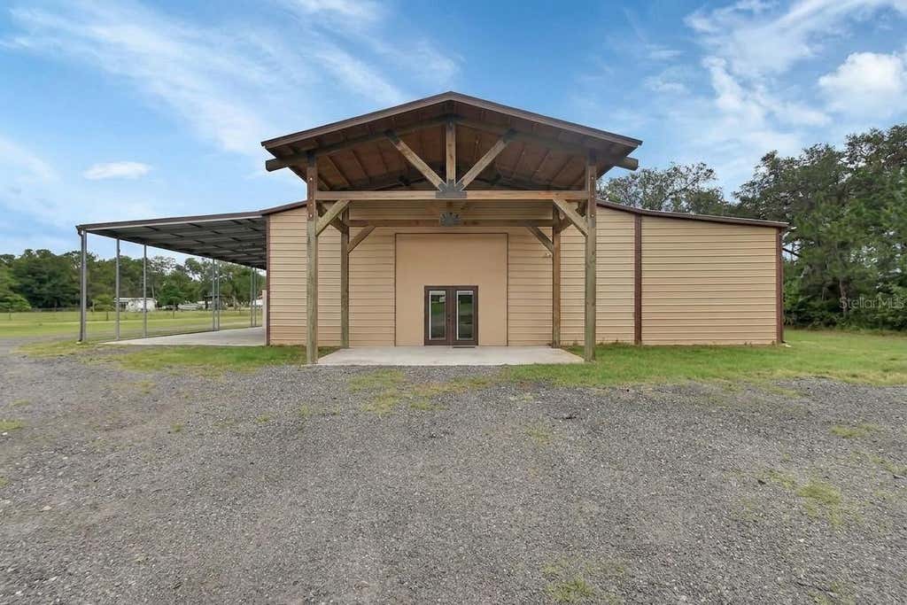Photo of 4940 State Road 11, De Leon Springs, FL 32130 (MLS # V4949576)