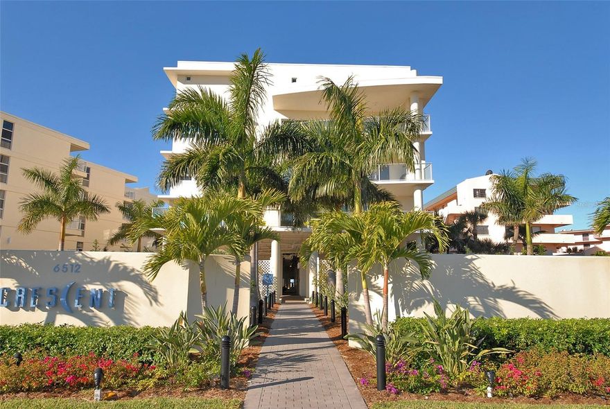 Experience Luxury Living on South Siesta Key! Welcome to your dream condo, perfectly situated on the pristine shores of Siesta Key. This stunning Gulf-front property offers unparalleled beach living, making it the ultimate coastal retreat. This corner unit is offered turnkey furnished, ready for immediate enjoyment. Impeccably designed in a contemporary beachfront style, 1600 sw. ft., 2-bedroom, 2-bathroom residence presents an expansive floor plan highlighted by a gourmet kitchen featuring top-tier appliances, granite countertops, soft close cabinets, and refined accents. The kitchen seamlessly transitions into a spacious living area accented by an artistic terrazzo accent wall opening onto an expansive terrace. Your terrace has a built-in outdoor kitchen, gas grill, and private access to the resistance heated lap pool with child safety fence/doors. The terrazzo wall continues through both bedrooms adding a sophisticated beach ambiance.  Master bath featuring dual sinks, a private toilet with automatic bidet amenities, deep soaking tub, and large walk-in shower. The additional bedroom for your guests includes an ensuite bath which offers ample space.  Wifi and remote controlled thermostat, door lock, gate, building, and beach access. Plus two owner’s storage closets for rental convenience.  This property serves as a tranquil retreat in an exceptional location, very quiet with very little street noise, whether you're seeking a permanent residence, a vacation getaway, or a profitable rental property.  The building boasts an array of amenities designed to elevate everyday living, including onsite management for added convenience and closed circuit camera/surveillance system for security. Residents can enjoy a beachfront heated pool, spa, and resistance lap pool right outside your door. A fitness center ensures residents stay active.  Dive into one of two pools or spa overlooking the beach, walk the white sugar sand beaches that stretch for miles, create fabulous meals in the outdoor kitchen and dine al fresco with a view of the gulf amidst beautifully landscaped gardens or sink into a chaise lounge under the loggias with a great book. At Crescent Siesta Key, embrace a lifestyle of comfort, luxury, and seaside serenity with all amenities conveniently at your disposal.