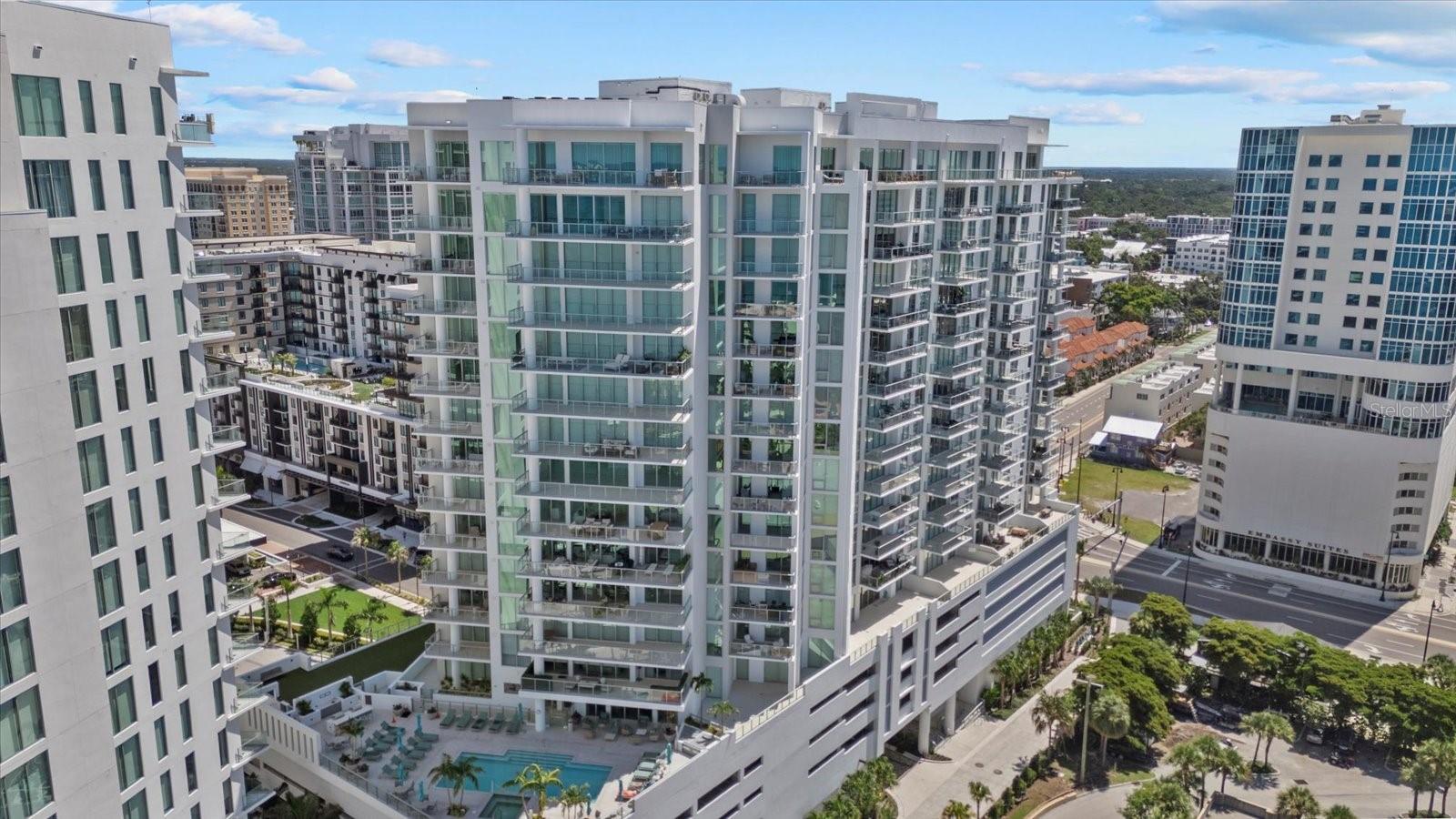 Discover unparalleled urban waterfront living in this exquisite two-bedroom, three-bath residence located on the 11th floor of 301 Quay Commons, Sarasota’s premier new bayfront tower at Bayso Sarasota. Built in 2023 by Kolter Urban, this expansive 2,185-sq?ft home boasts designer architecture and sweeping water views from every primary living space
Enter an open layout defined by soaring 10-foot ceilings, floor-to-ceiling windows, and porcelain tile floors that flow naturally to a deep, glass-railed terrace overlooking Sarasota Bay and the vibrant marina
Interiors feature elegant solid-surface counters, European-style cabinetry, tankless water heater, walk-in closets, a separate den, and a thoughtfully designed split-bedroom floor plan with luxe spa-like baths
The chef’s kitchen is styled with quartz countertops and premium stainless-steel appliances—whether entertaining or savoring quiet evenings, the flow from the kitchen to living area and terrace offers exceptional versatility and ambiance
Residents enjoy curated amenities including a resort-style elevated pool and spa, clubhouse with catering kitchen, a dog park, movement studio, and high-tech fitness center. The building provides 24/7 concierge service, key-card access, EV charging station options and two assigned garage spaces—ideal for lock-and-leave living. This is the way Sarasota is supposed to be lived.