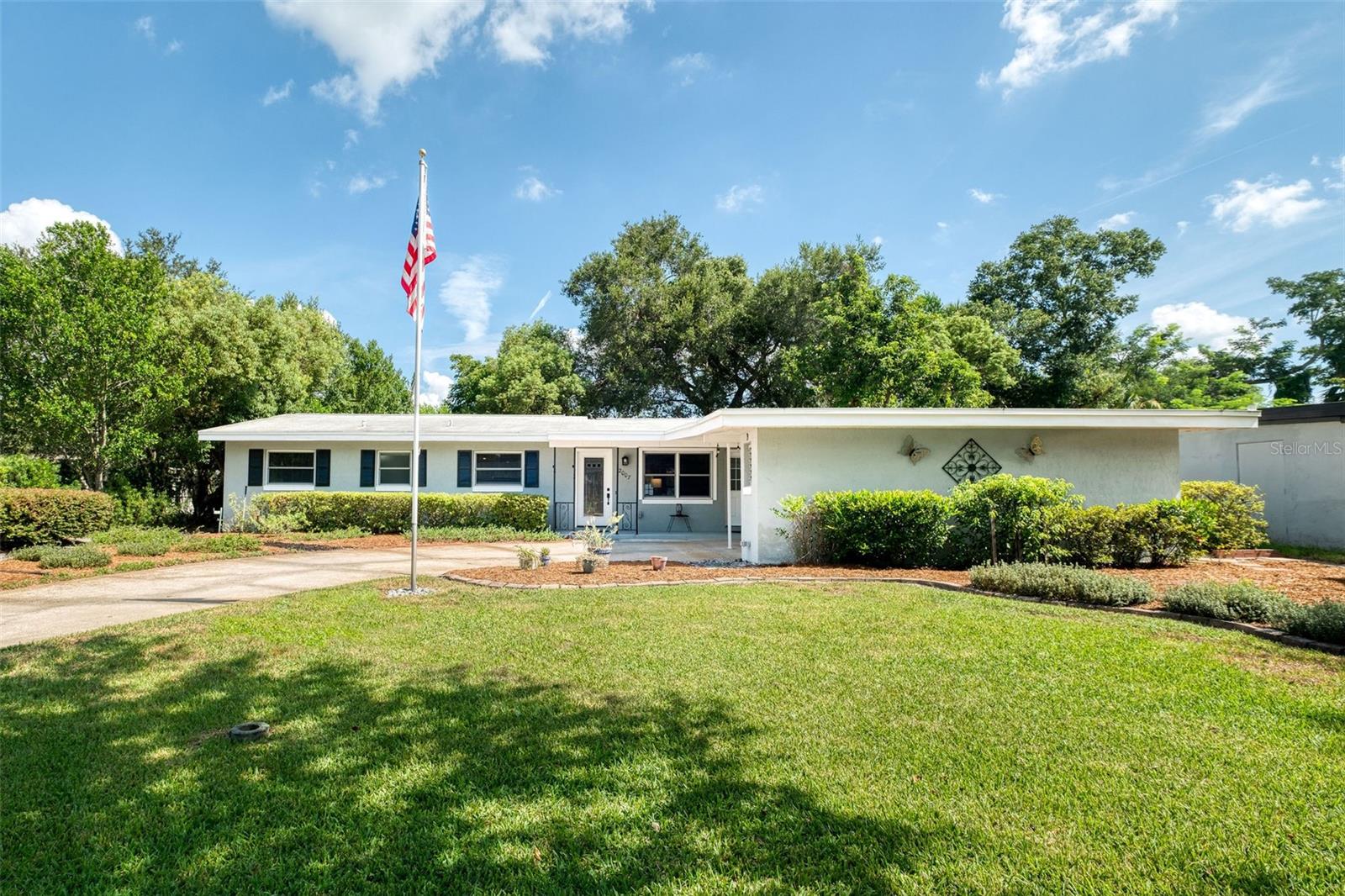 Stunning remodel with updates everywhere you look! This 4 bed, 2 bath home in Winter Park’s Kenilworth Shores is move-in ready, with the seller putting on a NEW ROOF before closing with an acceptable offer.
Step into the living room and enjoy the newer luxury vinyl plank flooring which flows through the living room, dining room, kitchen, and family room. The kitchen, fully remodeled in 2018, is the heart of the home, featuring solid wood cabinets with soft-close drawers, subway tile backsplash, granite countertops, and stainless-steel appliances.
Natural light ripples from the charming corner windows in the spacious dining room, (and all windows have newer 2” blinds). Enjoy time with the whole household in the large family/sunroom, which offers access and views to the paver patio and fully fenced backyard—perfect for grilling out or letting pets run and play.
All four bedrooms are located off the central hallway; the primary bedroom includes a beautifully remodeled ensuite with a tiled shower, granite-topped vanity, and two closets—one of them a walk-in. All bedrooms have a ceiling fan, and two rooms just had new carpet installed in July. The remodeled hall bathroom includes beautiful glass tile accents in the tub/shower surround, and a large granite-topped vanity.
Additional features include a laundry closet in the 2-car carport, well for irrigation, an extra storage room off the carport, updated electrical panels (2023), new PVC water line from the water meter to the house (2014), and a hot water heater (2020).
Located within walking or biking distance, 2007 Strathaven is zoned for top-rated schools—Brookshire Elementary, Glenridge Middle, and Winter Park High. Plus, only 1.5 miles away, Baldwin Park Village Center offers Publix, Seito Sushi, Five Guys, CVS, and more. Rollins College and the elegant cafes, bistros, and swanky shops of Park Avenue is just an 8-minute drive.
Come see this wonderful abode and make it your own “home sweet home!”
