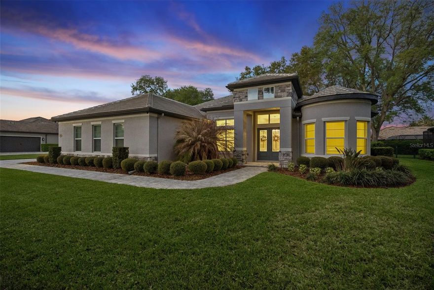 One or more photo(s) has been virtually staged. Luxury meets energy efficiency in this stunning single-story home in a serene setting amongst mature trees, scenic conservation areas surrounded by nature. Located in the gated community of RedTail, situated on nearly half an acre, this 3 bed, 3 bath and additional office/den home features a bright open floor plan, gourmet kitchen with quartz countertops, gas cooktop, built-in oven/microwave, abundant cabinetry, and walk-in pantry. The split layout offers privacy with a spacious primary suite, dual vanities, large walk-in shower, and closet. Corner sliding doors with retractable screens open to a large lanai and fenced backyard with room for a pool and outdoor entertaining. Enjoy low electric bills with a 10.4 kW fully owned solar system that powers, heats and cools whole home, plus tankless gas water heater, stove and dryer fueled by propane, LP gas hookups available for outdoor kitchen and fire pit, and oversized long 3-car garage. RedTail offers many amenities including golf, clubhouse dining, fitness center, tennis, pool. Conveniently located just minutes from downtown Mount Dora, Dora and Harris Chain of lakes, Wekiva Springs and State parks, Orlando theme parks, and beaches as well easy access to Orlando, Sanford International airport, 429 and major highways, shopping, dining and medical facilities while still enjoying the peaceful, nature filled setting of RedTail.