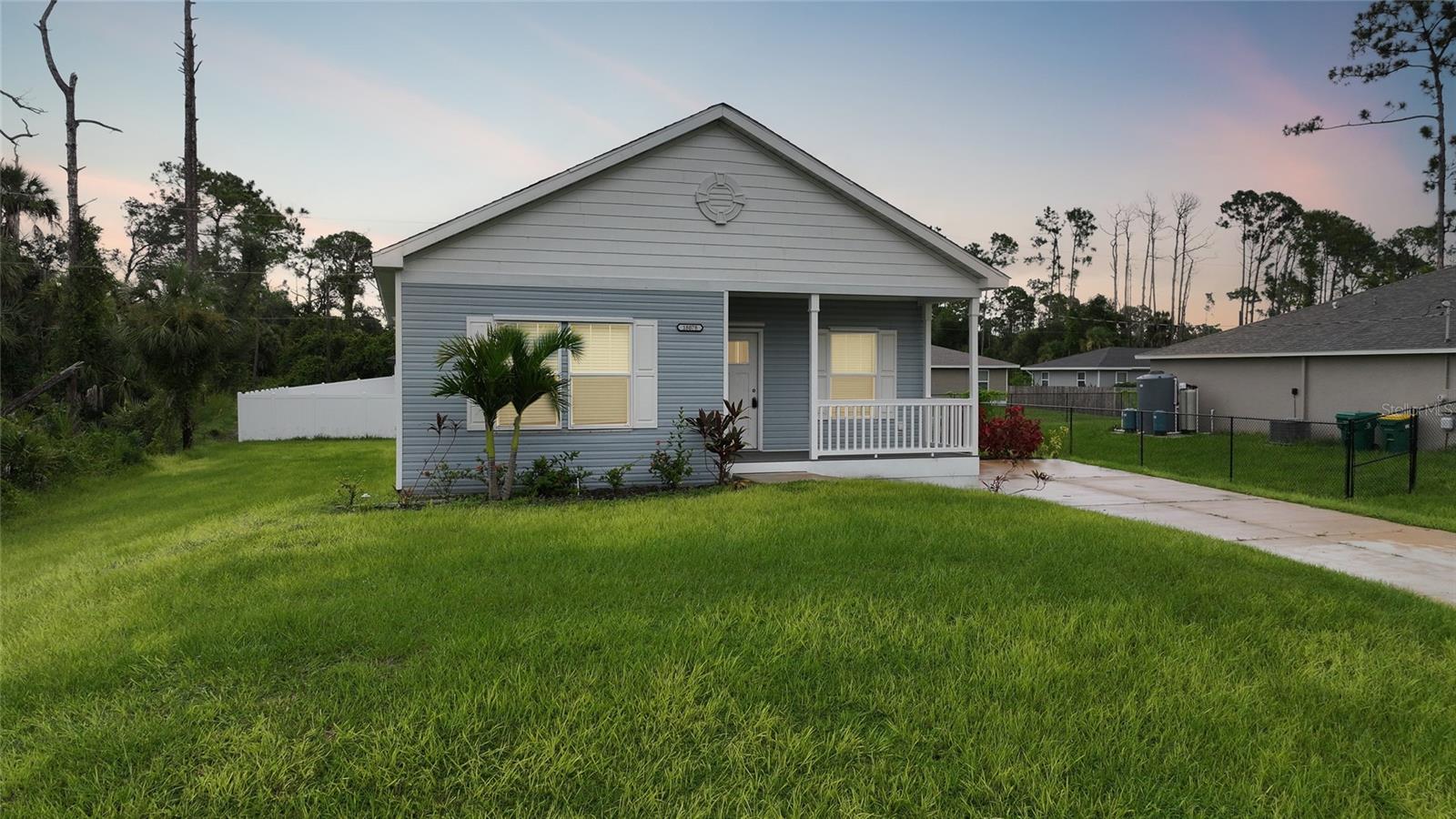 For limited time get 4.99% financing with preferred lender. SURVIVED HURRICANE DEBBIE, HELENE AND MILTON with barely a scratch. Cute as a button!!! This brand new home not in flood zone and comes with a home warranty. Sit on your front porch with your coffee and enjoy nature. As you enter this home you are greeted with light, bright decor and white washed wood plank wall. The kitchen is a dream with ALL upper end stainless steel appliances, center island, butcher block counter tops and gorgeous back splash. The master bedroom is a dream as it has a large closet and a gorgeous en suite equipped with a large walk in shower with a bench and dual sinks for that extra space. Another great feature of this home is the luxury vinyl through out that brings a rich warm feeling to this home. Laundry is not a problem in this home as it has its own laundry/ mudroom with bench and coat rack for ample storage. Also included in this gorgeous home is an irrigation system to help keep the lawn lush and green and storm panels for that added protection. The location of this home is perfect too. It is close to route 41 and I-75 for easy commuting. There are restaurants, shopping, golf courses and beaches near by and this home is also not far from the Rays and Braves spring training complex. You can easily travel down to Punta Gorda's cute down town or drive 30 minutes to beautiful Boca Grande. Make this cute as a button home yours today. It truly is a gem. Be sure to see the 3D tour that is attached to this listing.