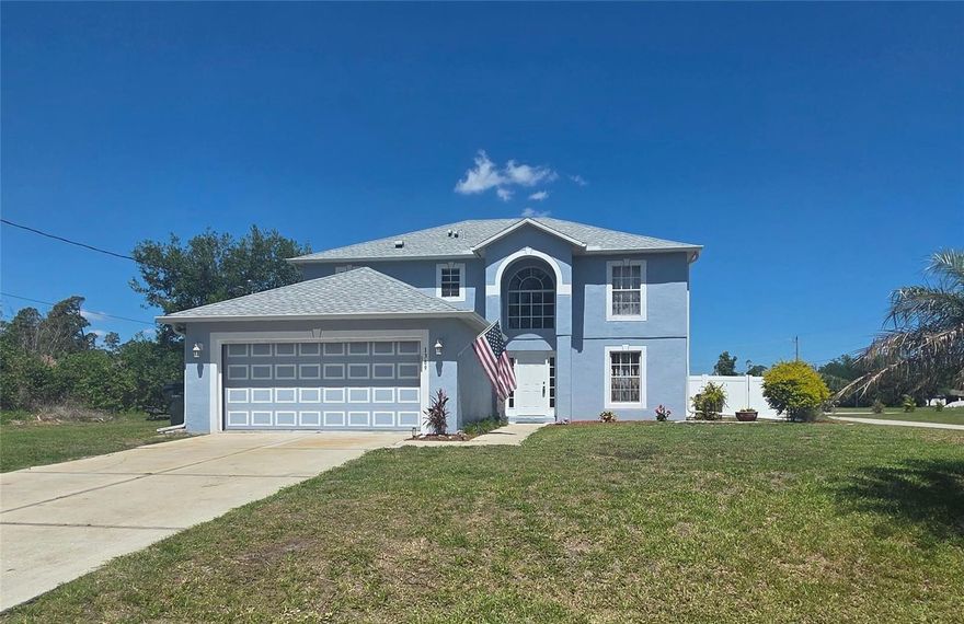 This expansive 2,248 sqft, two-story home features three bedrooms, two-and-a-half baths, and a two-car garage, all on a generous 14,974 sq ft corner lot. Located just about 5 miles (an 8-10 minute drive) from I-75 and in an area of Charlotte County that doesn't require flood insurance, convenience meets comfort. Inside, tile runs through most areas, with wood flooring in the Primary Bedrrom and carpet in the other two bedrooms. The open style kitchen includes an island for storage and extra cooking space. Enjoy a 2023 roof, 2024 AC, a 2025 well pressure tank and switch, and a 2023 garbage disposal. Outside, there's a newer pool cage and pump (2022), a large yard, shed, and a well-maintained water softener.