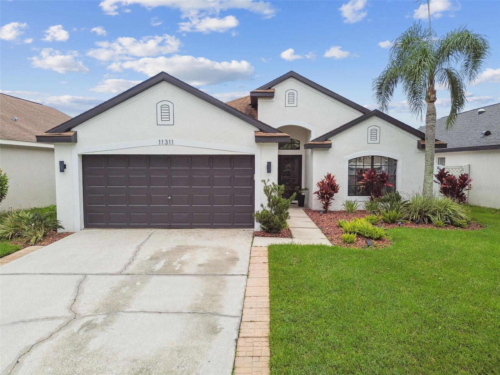 Welcome home to this beautiful and well-maintained property located in the gated community of Sheffield. This property offers 4 bedrooms, 2 bathrooms and den/office space with a 2-car garage in the heart of Westchase! Step inside to a bright and inviting split floor plan featuring high ceilings and a spacious open-concept layout that seamlessly connects the living room, dining room and kitchen. Designed with entertaining in mind, the home is filled with natural light and enhanced by luxury vinyl plank flooring throughout the living area, rooms and tile in entrance, kitchen and dining area. The kitchen features light gray cabinetry, quartz countertops, subway tile backsplash and stainless-steel appliances. The kitchen offers ample space for entertaining family and friends. A good size primary bedroom with walk-in closet and spacious primary bathroom with double sink and quartz countertop, tub and shower. 3 additional bedrooms with build-in closet, full bathroom and a den/office/flex space that can be used as a gym, playroom or office. Step outside to a fully fence backyard and enjoy Florida living with a lovely outdoor area with pavers. HVAC was replaced in 2022 and roof 2019.
Sheffield is centrally located near restaurants, coffee shops and more! Conveniently located close to Costco, Publix, Sprouts, and easy access to the Veterans Expressway, Downtown Tampa, Westshore Business District, International Mall and local beaches! Don’t miss your opportunity to own this move-in-ready gem in one of Tampa’s most sought-after communities.
