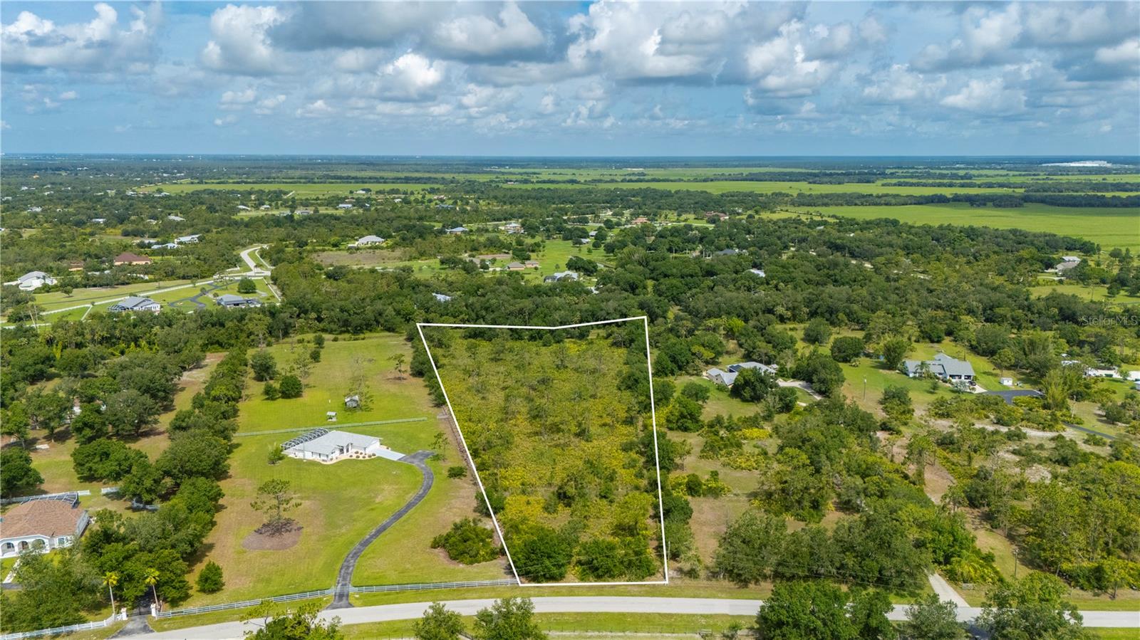 5.02 Acre Estate Home Site Situated in the sought-after community of Prairie Creek West, a Deed Restricted Equestrian Estate Community, with Beautiful Manicured Horse Trails, Nature Paths to explore and Greenbelts, offering you the perfect location to build your Dream Estate Home in a Serene and Graceful Country Setting. Plus you will be within a short Drive to everything, Dining, Golf, Boating, Fishing, Tennis, Pickleball, Shopping, Historic Downtown Punta Gorda, I-75, Arcadia, Sarasota, Fort Myers and all that Southwest Florida offers. Please note that the Scrub Jay Review Area Mitigation Fees have been paid