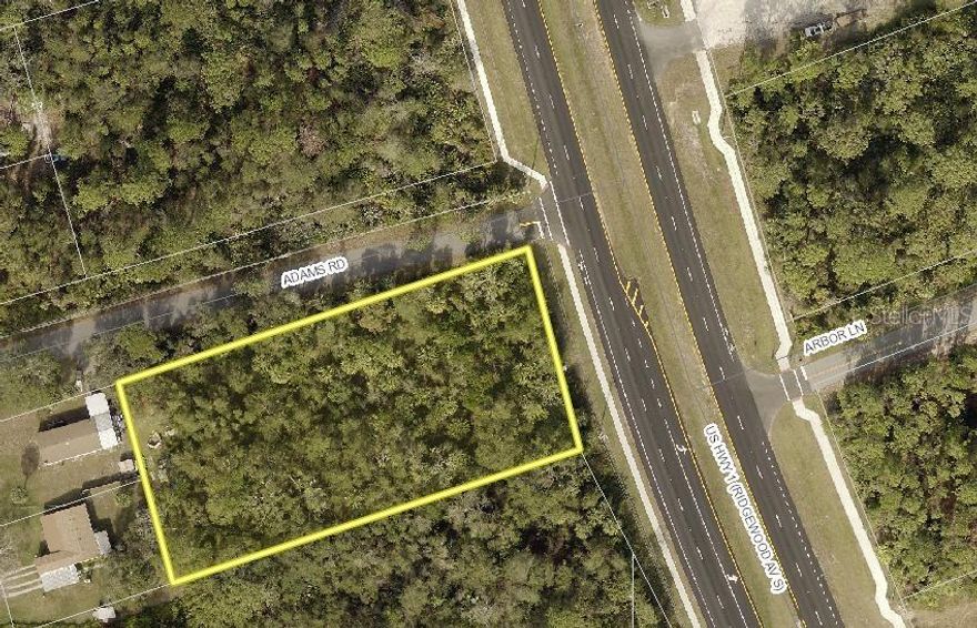 Commercial corner lot with 135’ of high visibility frontage on S. Ridgewood Ave. (US 1) Edgewater. This over 1 acre parcel can be accessed from S. Ridgewood Ave. or from the 325’ of Adams Rd. giving this parcel multiple development and traffic circulation opportunities. Site is near many new large residential developments allowing several ideas of future use. Property is also near some of the best fishing in area and boat launch facilities. Great location in a growing area of the community.; Cleared: No