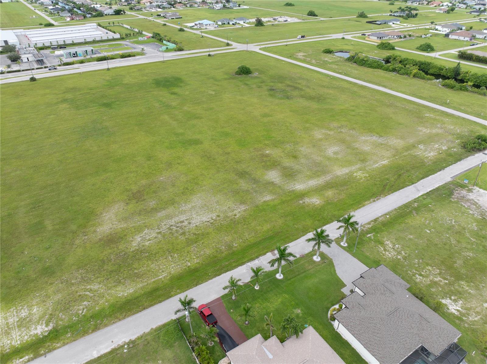 Prime 4-Lot Commercial Site in Rapidly Growing Cape Coral!
Opportunity awaits with this oversized commercial parcel spanning four contiguous lots at 3216 NW 9th St in Cape Coral. Perfectly positioned in one of the fastest-growing areas of the city, this property offers exceptional potential.
With excellent visibility, generous frontage, and easy access to major roadways, this site is ideal for investors, builders, or business owners looking to establish a presence in Cape Coral’s thriving Northwest corridor. The surrounding area continues to expand with new residential communities, commercial projects, and infrastructure, making this a smart investment for both immediate use and long-term growth.
Highlights:
4 adjoining commercial lots sold together
High-growth, high-traffic location in NW Cape Coral
Oversized parcel with ample frontage for maximum exposure
Close proximity to new residential developments, schools, and parks
Whether you’re planning to build now or land bank for the future, this is an opportunity you won’t want to miss.