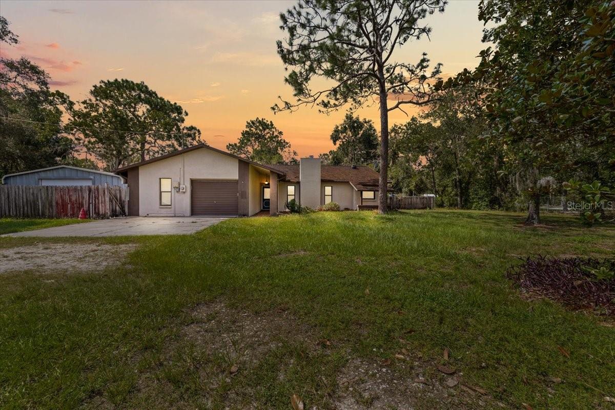 Welcome to 11712 Foxfire Drive, a versatile and thoughtfully designed single-family home nestled on 2.5 acres in Hudson. This 2,238 square foot residence offers 4 bedrooms, 4 full bathrooms, a den, Florida room, and a screened-in fiberglass pool, ideal for Florida living. The home features two en suites, including a spacious primary suite and a separate private suite—perfect for multigenerational living or a home-based business. Two of the bedrooms and a full bath can be closed off—perfect for a home office or guest quarters.
The kitchen is a highlight with its wall of floor-to-ceiling cabinetry, abundant counter space, and a dedicated coffee nook. A central vacuum system ensures easy maintenance, and a custom Murphy bed provides flexible guest space. Storage is abundant with multiple outdoor units and ample room for equipment, hobbies, or business use. A new roof is scheduled for installation in mid-August 2025, and a pre-inspection has already been completed for peace of mind. Conveniently located near SR-52 and the Suncoast Parkway, this home is a rare opportunity offering both functionality and flexibility.