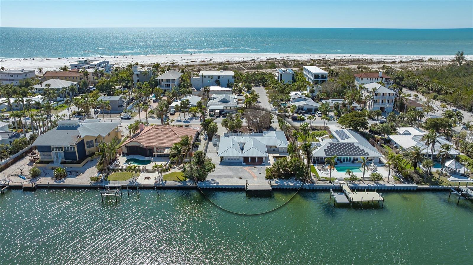148 N Polk is a Rare DOUBLE lot (16,000 sq ft) that checks "ALL THE BOXES". It's one of the very few properties that offers: a location only steps to the sands of Lido Beach, steps to the shops and restaurants of St Armand's Circle, is waterfront with a big bayou view and is a double lot. The lot also comes with a new seawall, concrete cap and dock. From this one-of-a-kind lot, you can design a home with a large rooftop terrace, and you will enjoy views of the Gulf of Mexico adding tremendous value to the home. HOUSE WAS FLOODED IN OCTOBER and the offering is for lot value only. Seller is also offering a new coastal elevated home on the property, approximately 3,500 sq ft AC for $6,995,000 including house and lot. Construction to be built by Sarasota's leading fine homebuilder, Seaward Homes. Other quality lots within walking distance of 148 North Polk have recently closed greater over $3.0m.