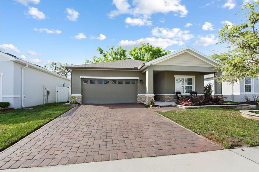 Welcome to this charming home located in the Dora Landings community in beautiful historic Mount Dora. Perfectly situated just a short, quick walk to the lighthouse at Grantham Pointe Lighthouse, this location allows you to enjoy peaceful lakeside strolls and some of the most beautiful sunsets over Lake Dora.

Historic downtown Mount Dora is only about one mile away, offering charming streets filled with boutique shopping, fantastic restaurants, cafés, galleries, and year-round festivals and art events that make Mount Dora such a beloved destination.

This 3-bedroom, 2-bath home offers 1,549 square feet of heated living space and includes a two-car garage. The open concept layout is comfortable and inviting, ideal for both everyday living and entertaining. The fireplace is electric and can stay if buyer would like.

Step outside to enjoy the screened-in porch, perfect for relaxing mornings or unwinding in the evening. The backyard is designed for enjoyment and easy maintenance, featuring a beautiful pergola for shaded outdoor seating, artificial turf that stays green year-round, and the perfect space to sit back and enjoy Florida’s stunning sunset skies.

Located close to major highways, shopping, dining, and everyday conveniences, this home offers easy access to surrounding Central Florida areas while still providing the charm and relaxed lifestyle of historic Mount Dora living.

Whether you're looking for a full-time residence or a seasonal retreat, 420 Spring Pond Lane offers comfort, convenience, and the unique lifestyle that comes with living near the lake and vibrant historic downtown. Come see why so many people fall in love with the lifestyle of historic Mount Dora—this home may be the perfect place to start your next chapter.