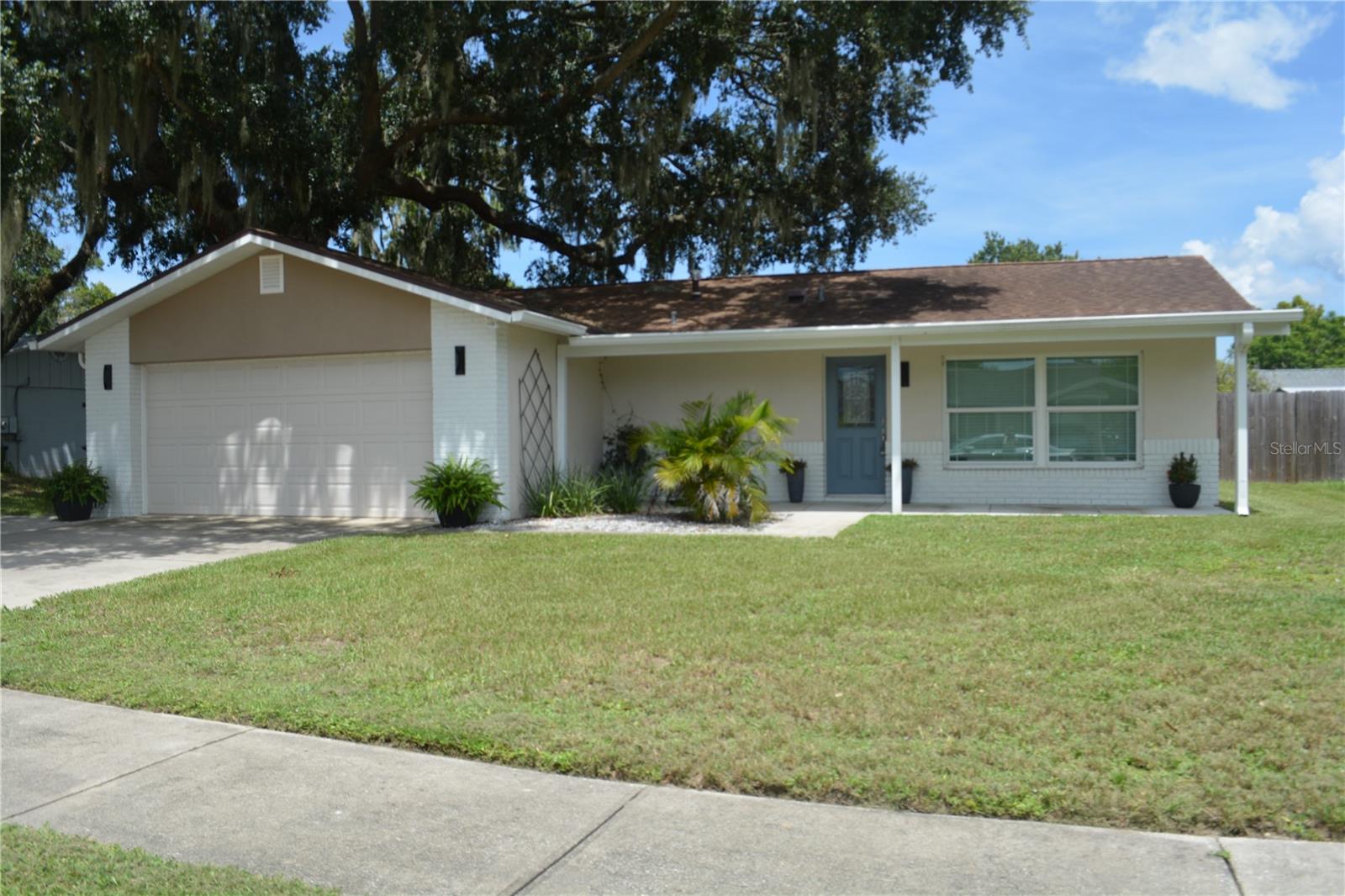 This house a large fenced in yard level with two gates * NO HOA FEE TO PAY * Open floor plan * Beautiful cathedral ceilings * soft close kitchen cabinets * quartz countertops in the kitchen * all stainless steel appliances * gas stove * bar area open to the family room for extra seating * separate dining off the kitchen * solid wood doors throughout the house * two walk in closets in both bedrooms * all renovated baths * tile from top to bottom in both baths * rain head in primary bath shower * screened in back patio with double slider doors * two car garage 20 x 20 * two extra storage closets * lots of natural lighting throughout the home and windows in both baths * inside laundry room. City water and City sewer. Private mailbox.