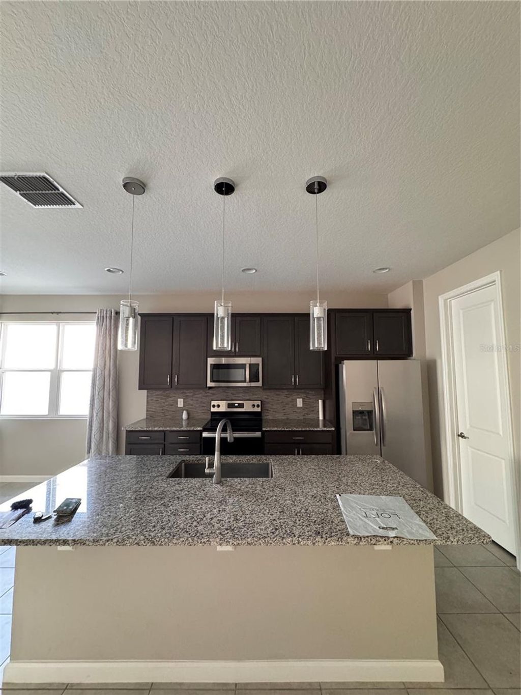 Photo of 541 Buchannan Drive, Davenport, FL 33837 (MLS # S5144343)