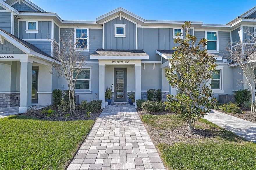 Beautifully appointed and move-in ready townhome literal WALKING distance to all the action and amenities of Waterside Lakewood Ranch. This home contains so many of the features and modern updates sought by today’s buyers. The downstairs is laid out in an open floor plan, including a spacious kitchen (with a massive island) outfitted with a gorgeous quartz countertop, sleek white cabinetry, eye-catching backsplash, and upgraded light fixtures over the island. Besides a large pantry for sundries, there is a generously-sized storage space tucked away beneath the stairs, a welcome addition in any Florida residence. While a half-bath is downstairs, all bedrooms and the full baths are upstairs for privacy. The two guest rooms are at the back of the home, separated from the spacious master bedroom This townhome also comes with a lovely courtyard connecting the home to the two-car garage. This is the perfect space to enjoy the area’s year-round lovely weather. Fans throughout the home have been upgraded, the garage floor is done with a durable epoxy finish, and this unit is one of only a few to offer additional parking spots in front of the home. Less than two-years old and built to current standards by the well-regarded M/I homes, this is a place to settle in and live with peace of mind for years to come. Nautique is a quiet, maintenance-free community with a low monthly HOA where the amenities include a resort-style pool, pickleball courts, dog park, playground, and even a PRIVATE boat dock for a ferry residents can take to Waterside and all of its shops and restaurants. Do not forget Waterside’s frequent events, including “Ranch Nite Wednesdays” and a farmer’s market every Sunday. While right at Waterside’s doorstep, Nautique is also almost perfectly located, convenient to not only greater Lakewood Ranch, but also downtown Sarasota and the ever-growing UTC area. I75 is easily accessible, and SRQ airport is a short drive west. 1756 Cleat Ln is a modern residence offering so much to anyone seeking the good life on Florida’s ever popular west coast. Schedule your showing today!