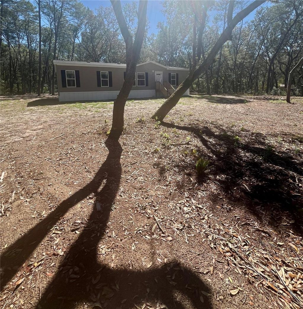 Photo of 400 S Holly Avenue, Florahome, FL 32140 (MLS # GC538696)