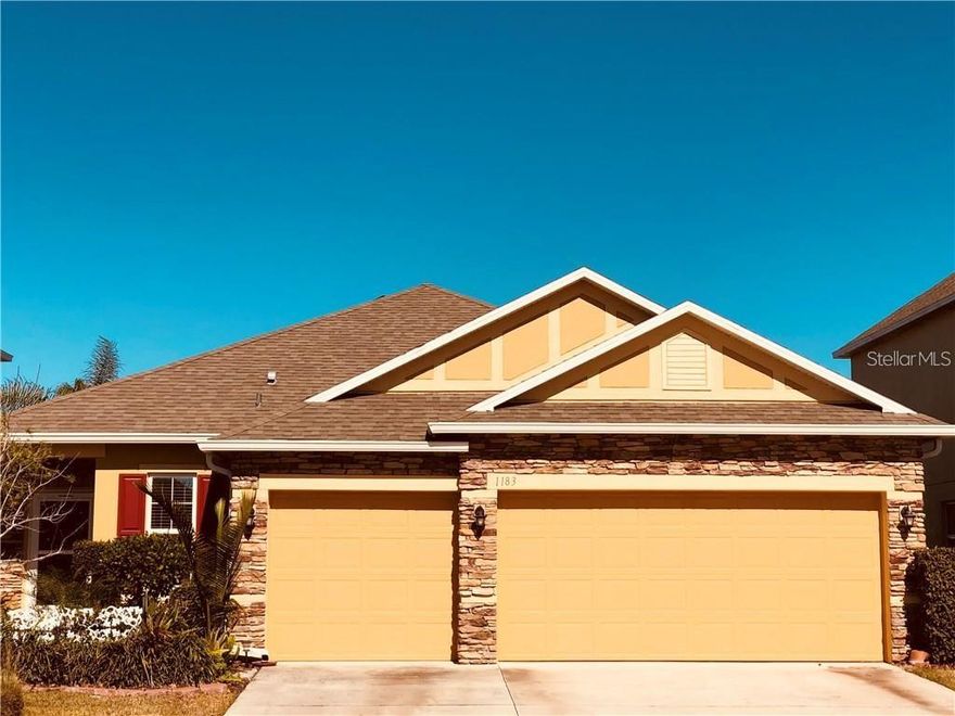 A MUST SEE! This 3 bedroom 2 bathroom home has been meticulously maintained. As you enter you are greeted with a long hallway. To the is a MUD room with a granite counter top, leading to the large 3 car garage, currently set up as a vehicle workshop with plenty of storage. Laundry room is complete with built in storage and shelves. Past the hallway is the kitchen with built in double oven, stove-top, microwave solid wood cabinets and granite counter tops. Kitchen Island has had a upgrade with intricate stone detailing and overlooks the large living room, perfect for entertaining. Office/Den is off the living room and has also had a upgrade with built in desk, shelving, granite counter top and the same stone detailing as the island. Home has crown molding throughout. Master bedroom comes complete with a good sized bathroom with dual vanities and walk in shower. Guest bathroom also has two vanities and a shower/bathtub combo. The backyard is your oasis, you can either relax in the Florida room, with screened in windows closing or open them all up and enjoy the breeze. There is a paved patio area also, perfect for entertaining. Backyard is fenced and nicely landscaped. It has a waterfall tucked in the corner.   Call to schedule your visit.