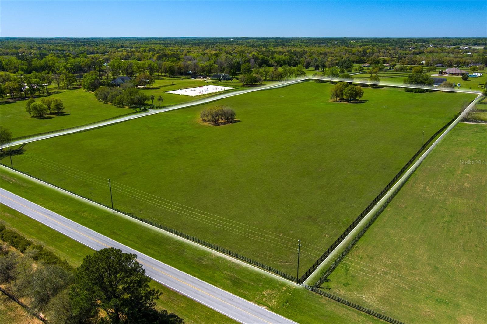 This 19.85-acre vacant property, located in Whispering Knoll, a private gated subdivision, offers a prime opportunity for building your ideal farm! Fully fenced and cleared making it an ideal canvas for your future plans. Its prime location places you just 5 minutes from the World Equestrian Center, offering world-class equestrian events and amenities, and only 10 minutes from HITS, making it perfect for those looking to be close to the heart of the equestrian community. Whether you're looking to create a serene getaway or build a functional farm, this property provides the perfect space and ideal location to bring your vision to life!