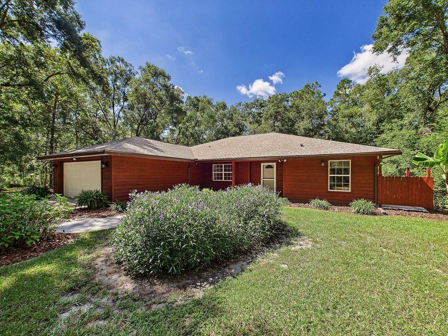 Move-in ready 3-bedroom, 2-bath home on 5 private, fully fenced acres. Located on a quiet, dead-end road shared with only three other homes, this 5-acre property provides privacy and ample space. No HOA or deed restrictions. The home features an open floor plan with a large living area, dining space, and kitchen. The split-bedroom layout provides a private owner’s suite with a walk-in closet and full bath. Two additional bedrooms and a second full bath are located on the opposite side of the home. The large deck and screened porch are ideal for entertaining. Exterior improvements include a 704 sq. ft. wooden deck (installed 2021, freshly stained 2025), new screened-in porch (2025), concrete sidewalks and garage pad (2021), new architectural shingle roof (2021), exterior paint (2021), and updated well plumbing and tank (2024). The pole building on the property could make a great workshop or a large space for additional storage. Enjoy quiet country living just 10 minutes from downtown Brooksville and direct access to the Good Neighbor Trail. The Withlacoochee State Forest and Weeki Wachee Springs are both nearby, offering more opportunities for outdoor recreation. Do not miss this rare opportunity to own a well-kept rural home offering space, privacy, and convenience — all in one property.