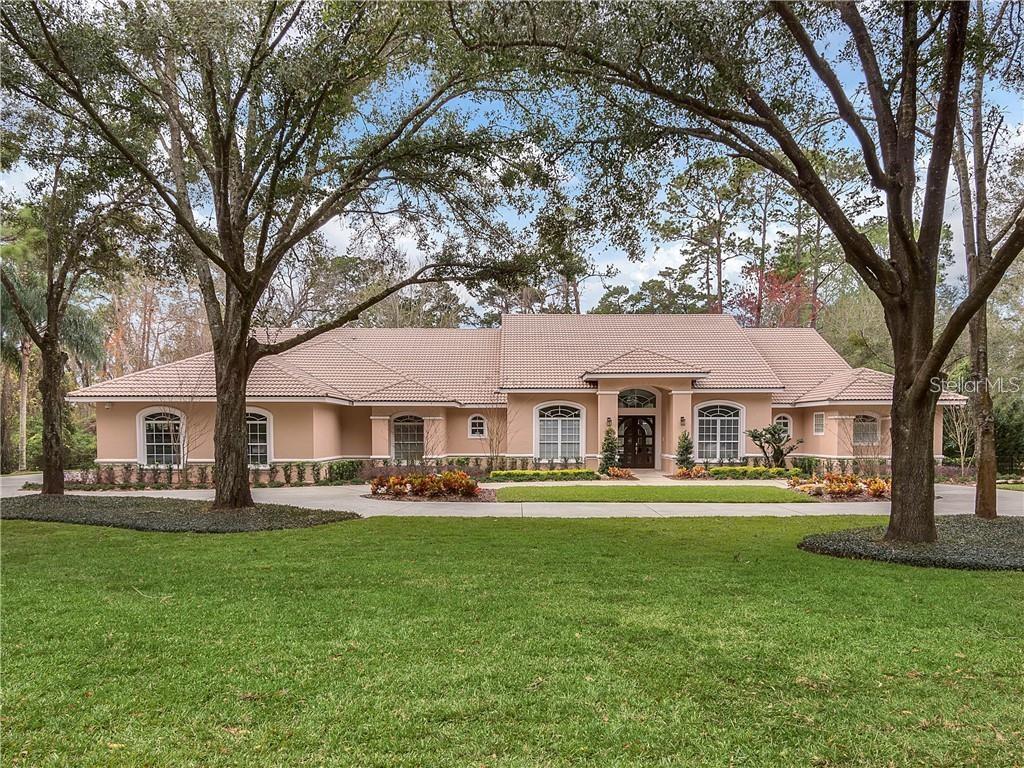 Under contract-accepting backup offers. Welcome to this stunning 4-bedroom, 4-bathroom home that offers a perfect blend of comfort and functionality. The property features a unique boat garage, ideal for watercraft storage or additional space. Inside, you'll find a spacious living room centered around a cozy fireplace, perfect for relaxing evenings. The dining area is equally impressive, highlighted by a beautiful chandelier and plenty of room for entertaining guests. The kitchen boasts sleek countertops and flows effortlessly into the main living spaces. The home includes a laundry room for added convenience and a walk-in closet in the primary suite for generous storage. Step outside to a large, covered pool area, perfect for year-round enjoyment. With ample outdoor space, this home truly has it all—style, comfort, and function.