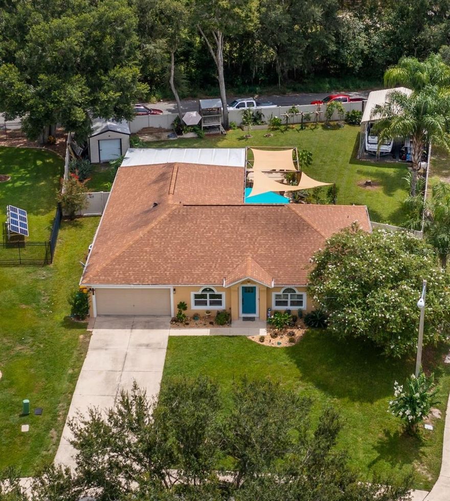 Looking for space and versatility, could you use 6 bedrooms? This stunning 4-bedroom, 2-bath home offers 2 additional flex rooms currently being used as bedrooms and another large bonus room — perfect for a large family, guests, or even your own home office or gym. With over 3,400 square feet under roof, there’s room for everyone and everything!
Take a video walk through now:  https://vimeo.com/1115934703
Step inside to discover: A bright, open-concept layout with a spacious living room & dining room, A generous 12x24 game room — perfect for entertaining, homeschooling, or a playroom, A beautifully updated kitchen with two pantries, a center island with sink, and ample cabinet space, Newer LVP flooring, NEW ROOF (2020), and A/C (2018), Whole-home water filtration system (2025) for peace of mind. Love outdoor living? You’ll fall in love with the massive 28x16 screened-in porch, the brick-paver fire pit and charming pergola area — ideal for cozy evenings under the stars. Need space for hobbies or storage? The 12x10 Lark shed is ready to become your workshop, studio, or craft haven! The backyard is fully enclosed with superior vinyl fencing and features an 18’ wide double gate for easy access to the backyard via a  quiet dead-end street in the rear for extra parking for boats or trailers. But that’s not all — your new home is just steps away from a community playground, and less than 2 miles from Fruitland Park’s top amenities: Public pool, Pavilions & picnic areas, Youth sports, movie nights, park days, and an annual BBQ cookoff, Lake Griffin State Park nearby with boat launch access to the Harris Chain of Lakes, Looking for nightlife or entertainment? You’re only 10 miles to Brownwood for live music, dining, theaters, and more! Tucked in a peaceful, friendly neighborhood, this home offers that rare combination of quiet seclusion and convenient access to everything you need. Book your private tour today.