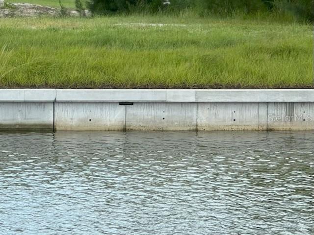 NEW SEA WALL INSTALLED Come Build your Dream Home on this Gulf Access Waterwront Lot ! Vacant lot with the opportunity to build your custom home. Gulf access for boating enthusiasts.A brand new seawall, with no waiting required to install one. One bridge to open waters, with a 10 ft clearance. Located on the Christmas Boat Parade route, making for scenic, festive views during the holiday season. Approximately 20 minutes to open water, perfect for quick boating adventures. This lot is perfect for those who love boating and waterfront living!