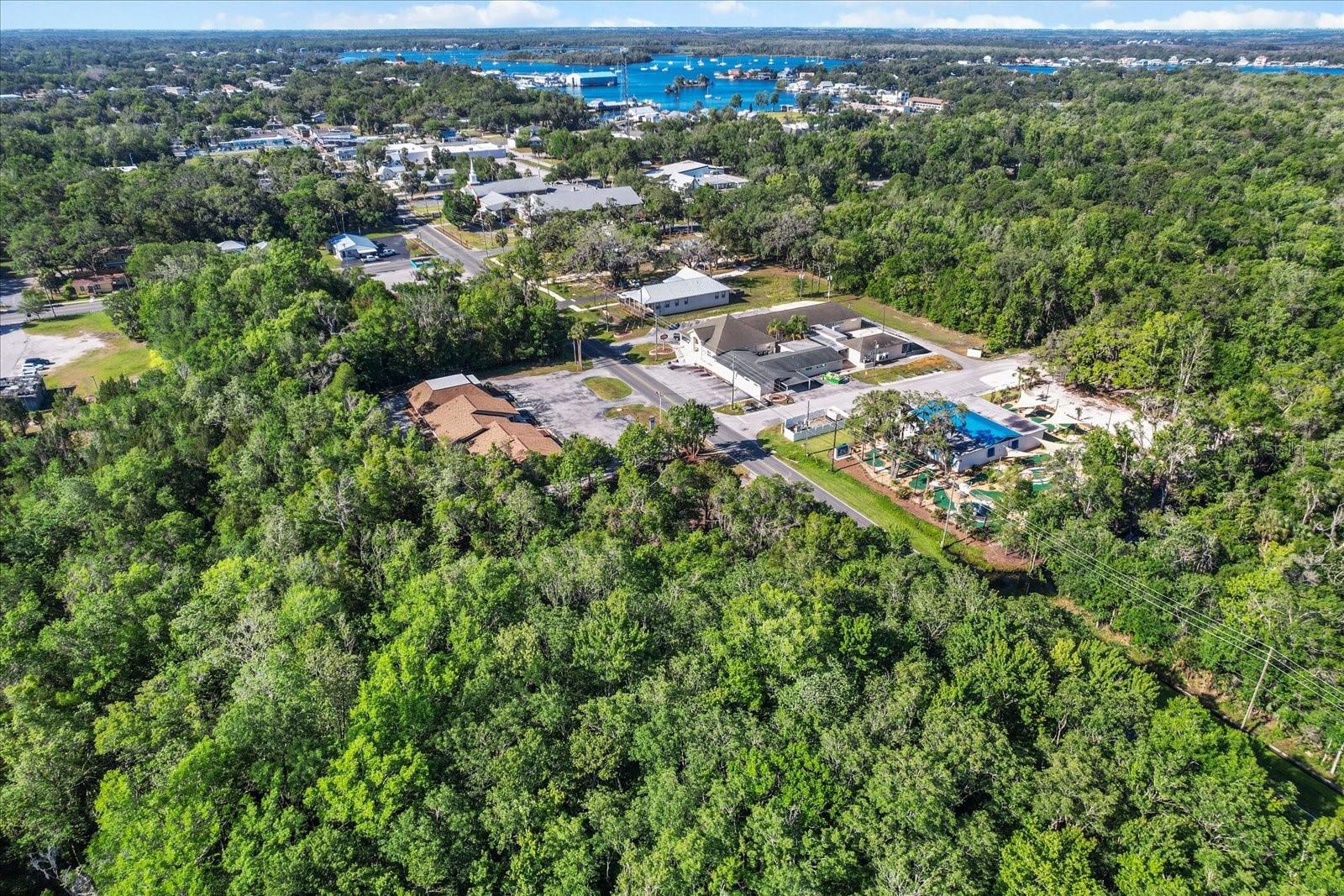 Steps from Historic Main Street Crystal River, Florida and the beautiful riverfront views of Kings Bay. Unlock the full potential of this vacant lot located directly on Citrus Avenue, in the heart of downtown. Recently rezoned to Urban Center Two (UC2), this property offers incredible flexibility with allowable uses including commercial, retail, office, single-family and multifamily residential. Attached are preliminary pictures for 3 - 2 Bedroom Villa apartment units as an example of what you do on this property. Enjoy a scenic, spring-fed river canal right on the lot, adding natural beauty and value to your project. Utilities are ready to go with existing impact fee, water, and sewer credits. With its high-visibility location, walkable surroundings, and proximity to local shops, restaurants, and the waterfront, this is an amazing property!