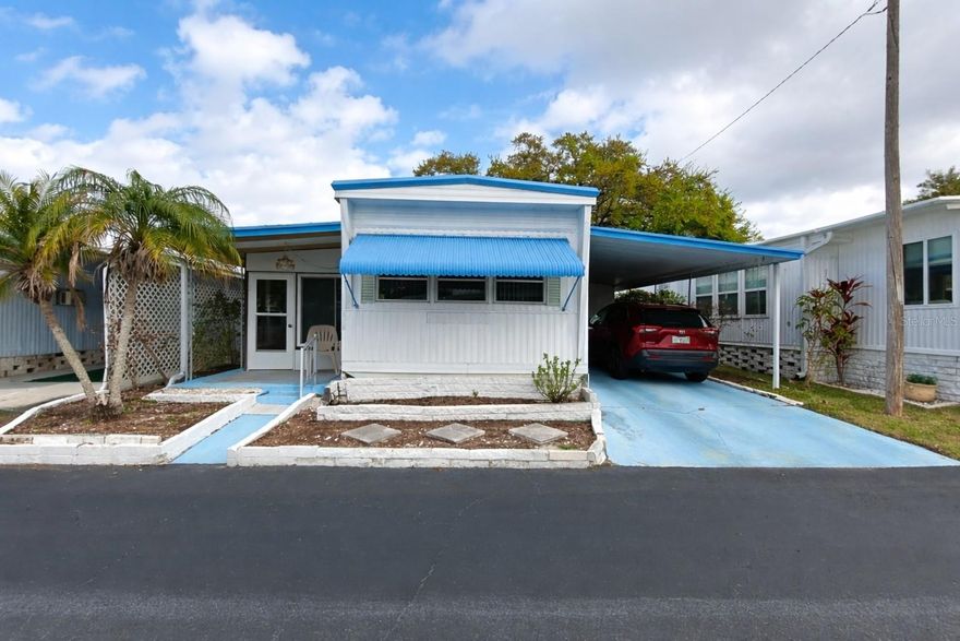 Move-in ready and updated! This charming 1-bedroom, 1-bath mobile home is located just off N Old Coachman Road in a well-maintained 55+ community with low HOA fees. The home features an updated kitchen, laminate flooring, fully enclosed porch with an in-unit washer and dryer, offering comfortable and easy-to-maintain living.
The bright, open layout makes the space feel welcoming, while the screened porch provides a perfect spot to relax and enjoy the Florida weather. The home also includes its own tie-down pole and has already been properly secured, adding additional peace of mind. Residents enjoy a beautifully maintained community with amenities including a clubhouse, shuffleboard court, and a peaceful pond with park-like surroundings. The location is ideal—close to walking trails, Coachman Ridge Park, and The Long Center recreation facility, also just minutes from Countryside Mall, restaurants, shopping, and entertainment, with quick access to US-19, Tampa International Airport, golf courses, and the Gulf beaches. The low $190/month HOA fee includes water, sewer, trash, and common area maintenance, making this an excellent opportunity for affordable Florida living. HOA approval required. No pets and no leasing permitted. Call today to schedule a private showing or request a FaceTime tour. Some of the photos have been virtually altered.