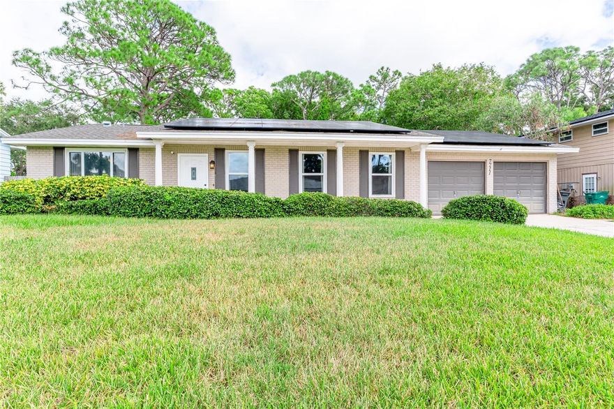This recently renovated 4 BEDROOM, SPLIT FLOOR PLAN,  2 BATH POOL HOME features over $100k in RECENT UPDATES, and sits on a generous .26 ACRE LOT!  THE SOLAR SYSTEM (2018) reduces your power bill to an average of $40.00 a month, panels included in purchase price.  The covered front patio welcomes you into this modern, spacious open floor plan home. Immediately as you enter you will notice the openness of the floor plan, the NEWLY INSTALLED LUXURY VINYL FLOORS, which makes this the perfect home for entertaining.  The FAMILY ROOM has French Doors that open to enormous backyard with lush landscaping.  The concrete pool RESURFACED with PEBBLE TEC, features a NEW TRAVITINE POOL DECK surrounding the pool, with a completely fenced in backyard. The covered-screened in lanai overlooking the pool, provides shade and the perfect place for that morning cup of coffee or to unwind in the evening.  Master Suite will accommodate most any bedroom set , 14x20.  Master Bath recently updated (2025) with a sleek modern designer vanity.  Second bedroom is also oversized (12x17) and could easily be used as a second master bedroom.  The eat in Kitchen is open to the family room, NEWER STAINLESS STEEL RANGE, REFRIGERATOR + MICROWAVE.  INSIDE LAUNDRY, WASHER + DRYER 2022 transfer with the sale.  So many extra features...TANKLESS WATER HEATER, TOTAL HOME FILTRATION SYSTEM, 3 CAMERA SECURITY SYSTEM OUTSIDE, INTERIOR ALARM SYSTEM WITH CAMERA, ROOF 2018, AC 2022, MANY NEW WINDOWS 2021 just to name a few.  NO FLOOD ZONE, NO HOA, LOCATED ON A CUL DE SAC STREET.  This home has been meticulously kept + offers the PERFECT FLORIDA LIFESTYLE.  SEMINOLE CENTER + AWARD WINNING BEACHES 5 MINUTES AWAY.  This beautiful home in move in ready, it combines comfort + style.  Make your appointment today!