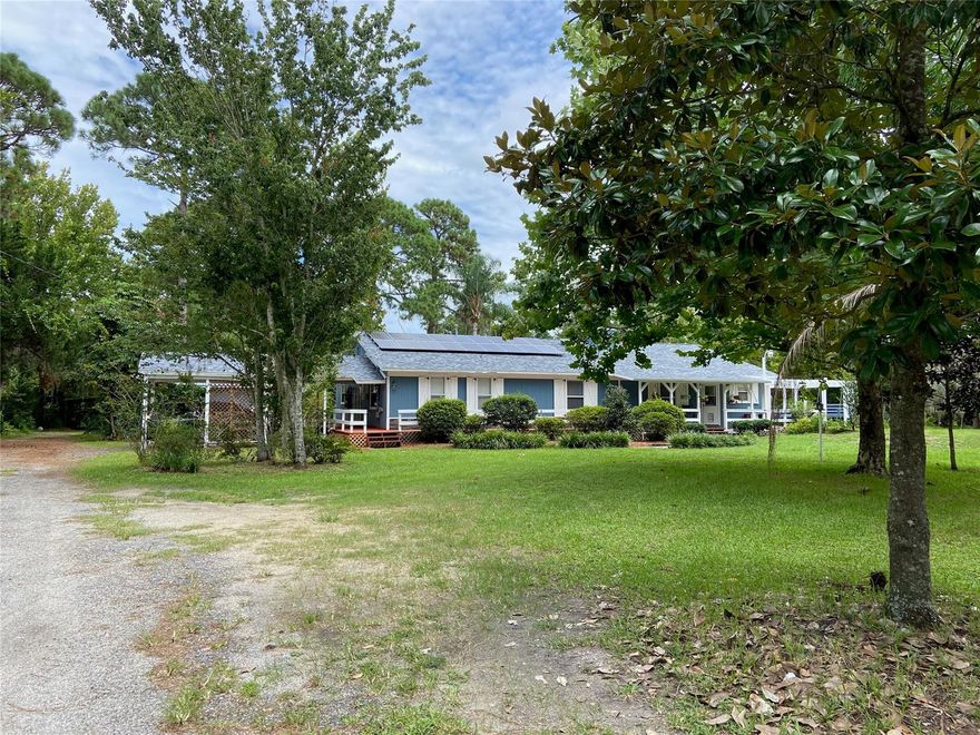 Gated and private 3.43 acres on Pioneer Trail close to shopping, restaurants and interstate. This home features a 1 bedroom in-law suite with a full kitchen, bathroom with standing shower and living room! Main house has 2 bedrooms, 2 bathrooms plus an entry room that can be a formal living room, library or den. A living area with a wood burning brick fireplace. 20x24 Florida room overlooks the sparkling pool. Spacious kitchen, with a large central island with seating. Lots of counter space. Indoor laundry room off kitchen has great storage. Exterior has beautiful sitting areas. There is a 30x40 workshop for tools and equipment. Additional one car garage AND an open shed for lawn and garden equipment. Outsider shower. Well maintained. This location is "in town and country".