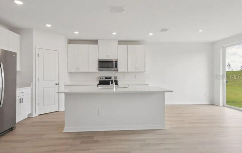 Photo of 12562 Hourglass Way, Dade City, FL 33525 (MLS # TB8488657)