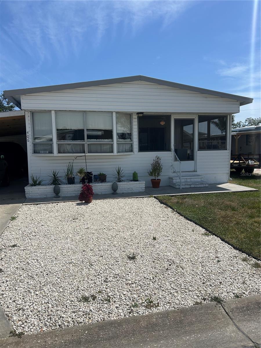 Charming Double-Wide in 55+ Community – No Lot Rent!
Welcome home to this adorable and affordable double-wide manufactured home nestled in a peaceful, well-kept community—where you own the land and enjoy low monthly fees of just $70, keeping the park pristine and the amenities in top shape.
Step inside to find new laminate flooring flowing through the spacious living area, perfect for relaxing or entertaining. The large screened lanai at the front of the home is a sunny haven, filled with natural light—your new favorite spot for morning coffee or an evening breeze.
You’ll love the brand-new carpet in both bedrooms, offering soft comfort underfoot, and the convenience of a gas stove and water heater. A brand-new heavy duty wood carport adds great curb appeal and protection from the elements.
The friendly community offers a laid-back lifestyle with access to a clubhouse, library, shuffleboard courts, BBQ grill, and picnic tables—perfect for socializing with neighbors or hosting friends and family.
Don’t miss your chance to live in this inviting, low-maintenance home in a vibrant community where you can truly enjoy the good life!
The best part of all, this is a very friendly pet community!