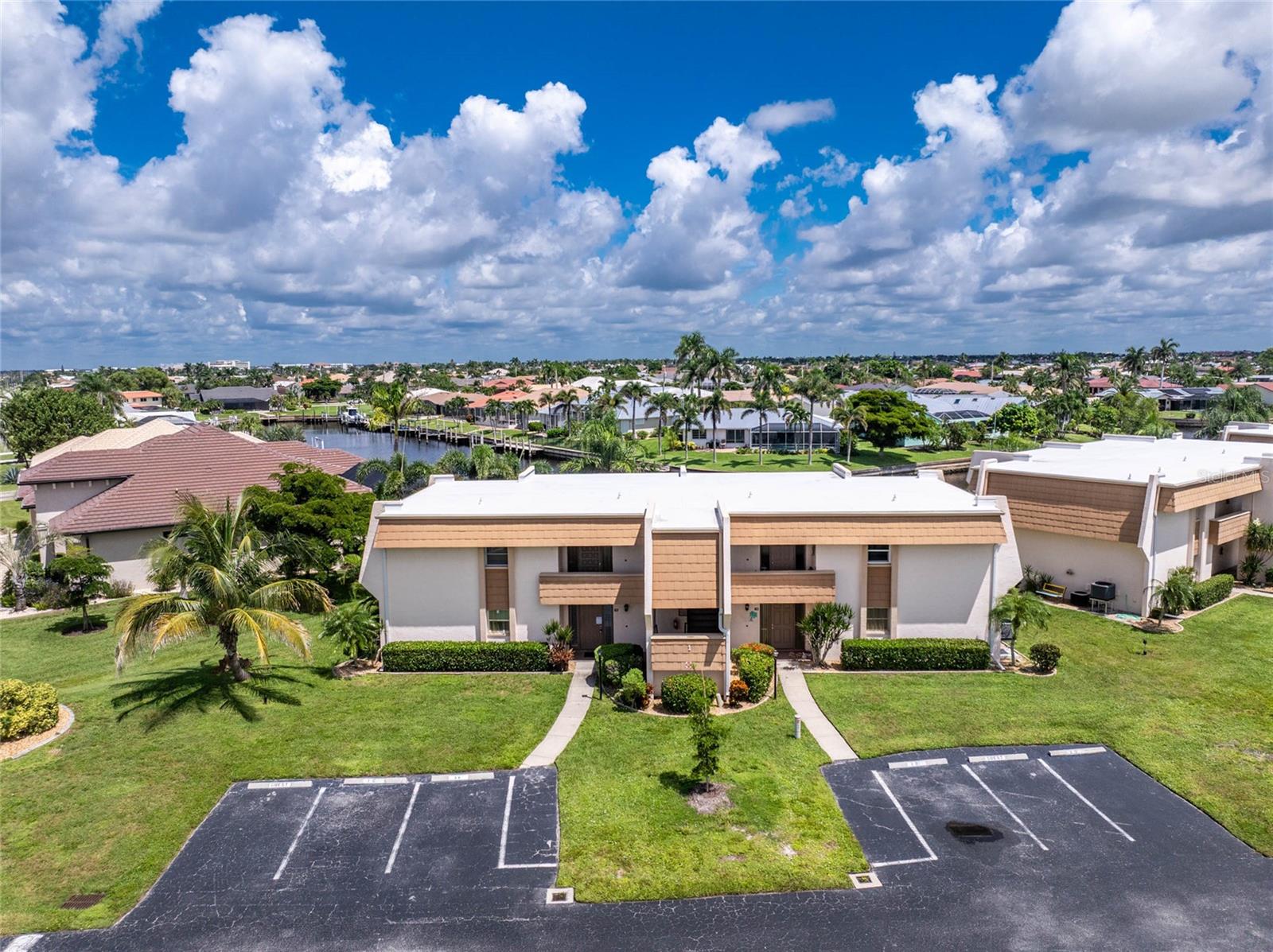 Welcome to Islander Point, where everyday living feels like a vacation! This 2-bedroom, 2-bath first-floor condo offers 1,114 sq. ft. of comfort and convenience in the heart of Punta Gorda. Inside, enjoy a spacious great room, tile flooring throughout, a bright kitchen, and a private lanai with tranquil views.
Step outside to soak up the Florida lifestyle—relax by the beautiful community pool, stroll along the water’s edge, or set out from your own boat dock. The community has been thoughtfully updated with new roofs (Dec 2023) and a brand-new dock (Apr 2024) offering direct access to deep water canals into Charlotte Harbor. From the back of the property, take in peaceful water frontage and water views. For boating enthusiasts, new owners have the chance—on a first-come, first-served basis—to secure an assigned dock space, making every day an adventure on the water.
Beyond the community, your weekends can be spent at Fishermen’s Village for waterfront dining, boutique shopping, and live music, or at the Punta Gorda Yacht Club for social gatherings and sailing. Explore downtown’s charming historic streets, enjoy year-round festivals, or bike along the scenic Harborwalk.
This condo isn’t just a home—it’s a gateway to the coastal lifestyle you’ve been dreaming of. Whether full-time, seasonal, or investment, Islander Point is your key to living the best of Punta Gorda.